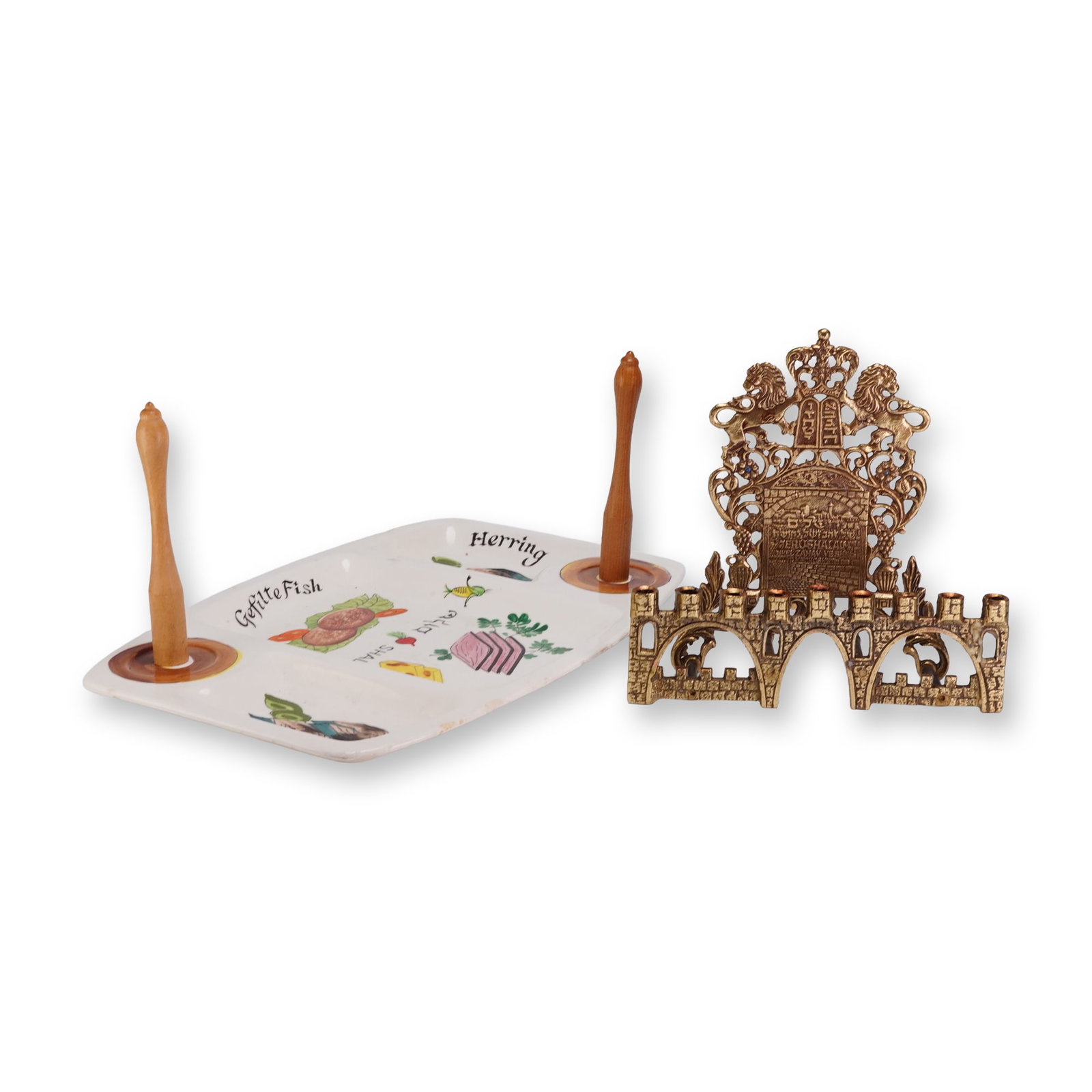 2pc Judaica Hanukkah Menorah and Platter: A two-piece collection of 20th-century Judaica comprising a cast brass Hanukkah menorah and a decorated ceramic serving platter. The bench-style Hanukkiah is constructed of cast brass with a gold-tone