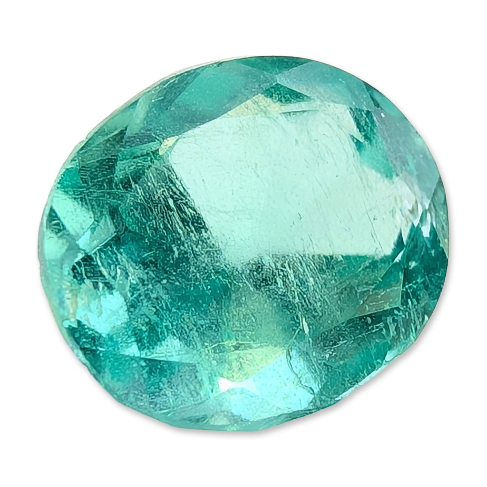 Loose Oval Mixed Cut Emerald Gemstone: Loose gemstone appearing to be a natural emerald. The stone features a saturated bluish-green color and is fashioned into an oval mixed cut with a medium-to-deep pavilion. Visible internal characteris