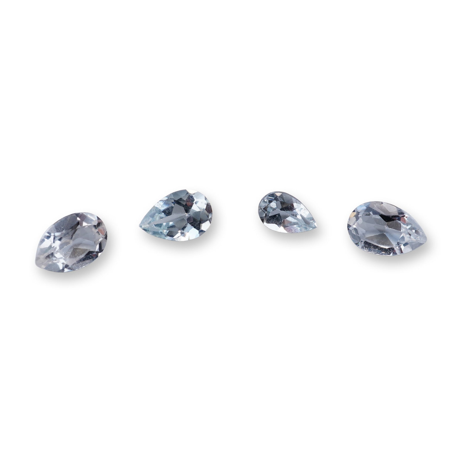 Collection of Pear Cut Aquamarine Gemstones: Collection of loose pear cut aquamarine gemstones. Each stone features a brilliant-style facet pattern and exhibits a pale blue color. 1.3ct Dimensions: 6W MM