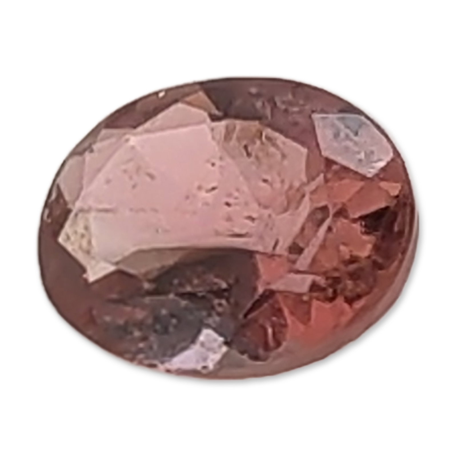 Oval Cut Pinkish Brown Faceted Tourmaline Gemstone: Loose faceted Tourmaline gemstone, oval cut, featuring a medium-tone reddish-purple to pinkish-brown hue. The stone exhibits visible internal inclusions, including feather patterns and small clouds