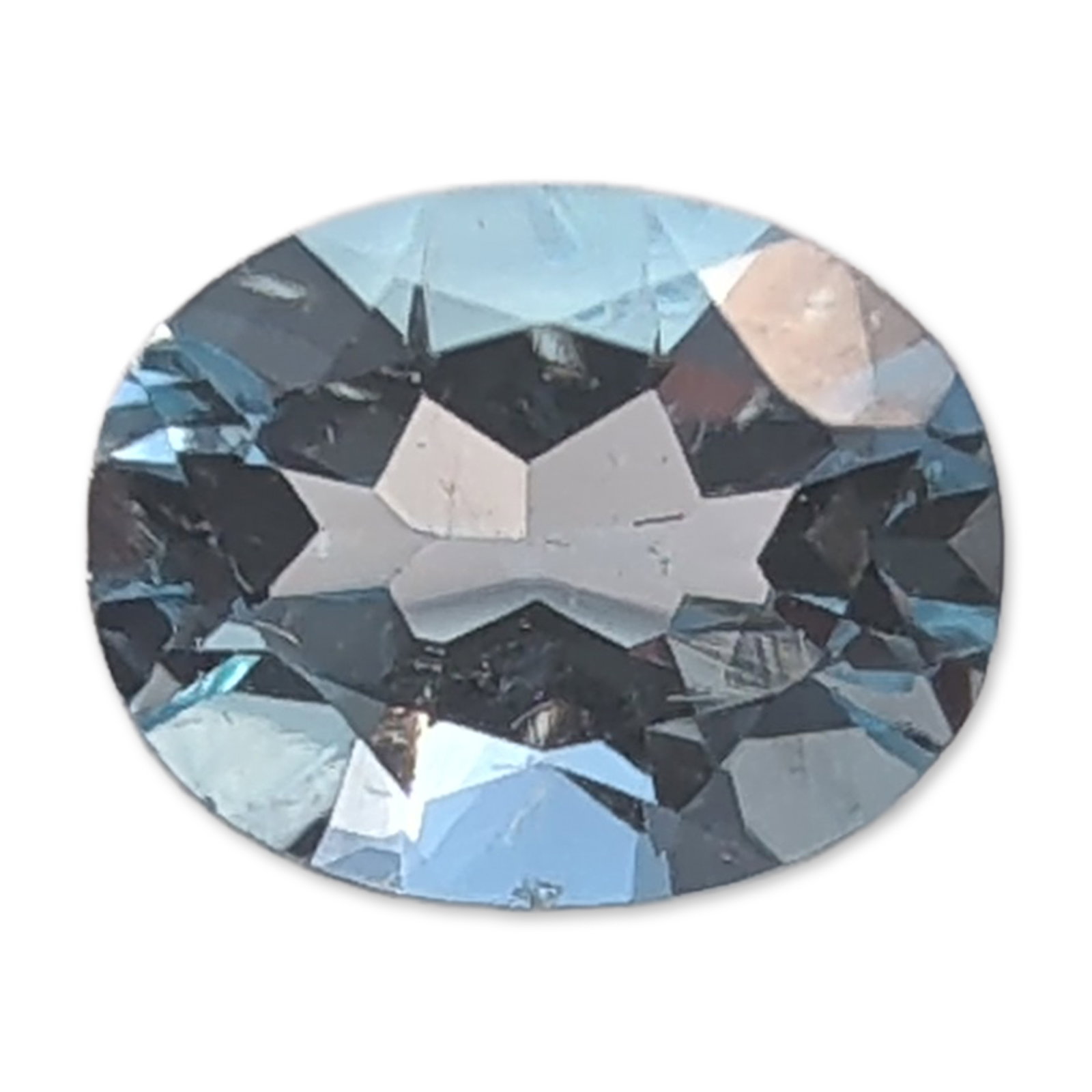 Oval Faceted Light Blue Gemstone: Loose faceted topaz gemstone in a light blue hue. The stone is presented in an oval faceted cut with a transparent appearance and eye-clean clarity. Facet edges appear sharp with no visible surface ab