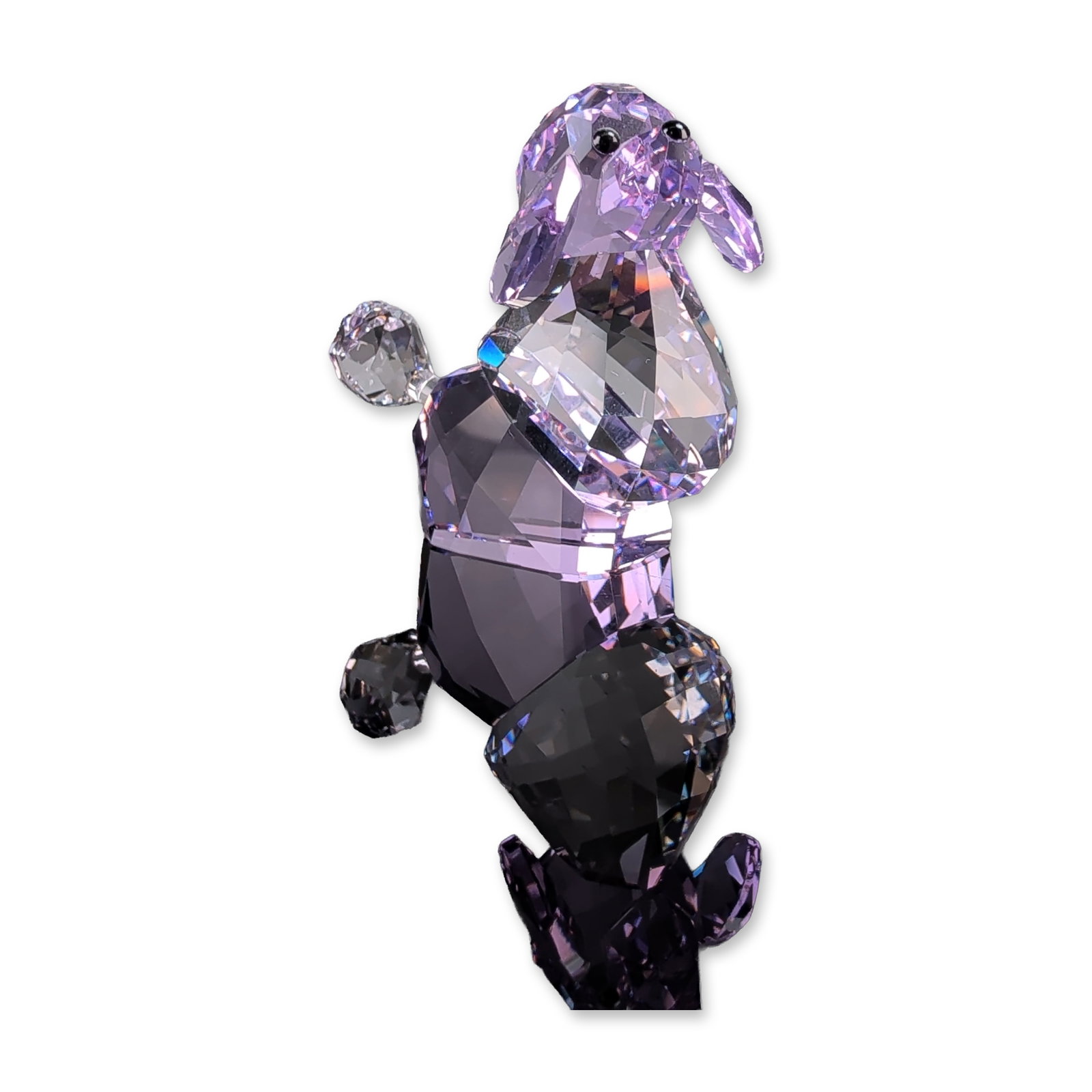 Swarovski Lovlots Violetta the Poodle Crystal Figurine: Swarovski Lovlots collection figurine, Violetta the Poodle, part of The Gang of Dogs series. Crafted in faceted lead crystal with an amethyst colored body and head, complemented by clear crystal accen
