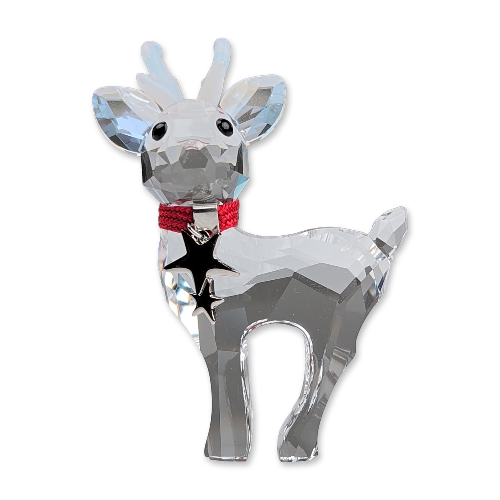 Swarovski Crystal Figurine, Baby Reindeer: This crystal figurine is crafted with a faceted clear crystal body and head, complemented by opalescent crystal antlers and black crystal eyes. The design features a red braided textile cord collar wi