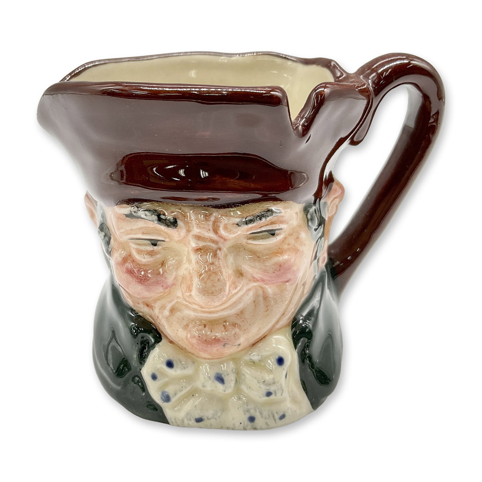 Old Charley D6046 - Mini - Royal Doulton Character Jug: Brown hat; dark green coat; blue polka-dot bow tie. Royal Doulton backstamp. Artist: Charles J. Noke Dimensions: 2.25"H Date or Era: 1939 - 1983 Manufacturer or Brand: Royal Doulton Country of Ori