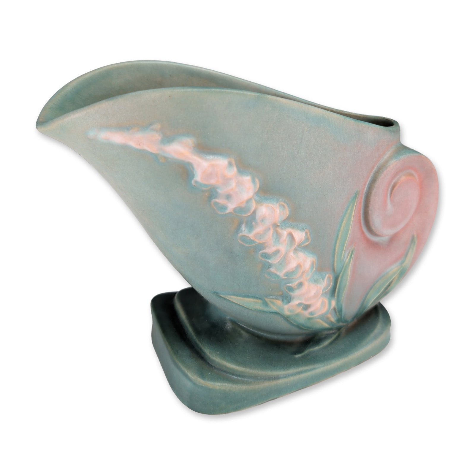 Roseville Foxglove Pattern Pottery Cornucopia Vase: Roseville Pottery cornucopia vase in the foxglove pattern. Earthenware body with molded relief decoration depicting blossoms on a textured surface, finished in a matte glaze transitioning from pink to