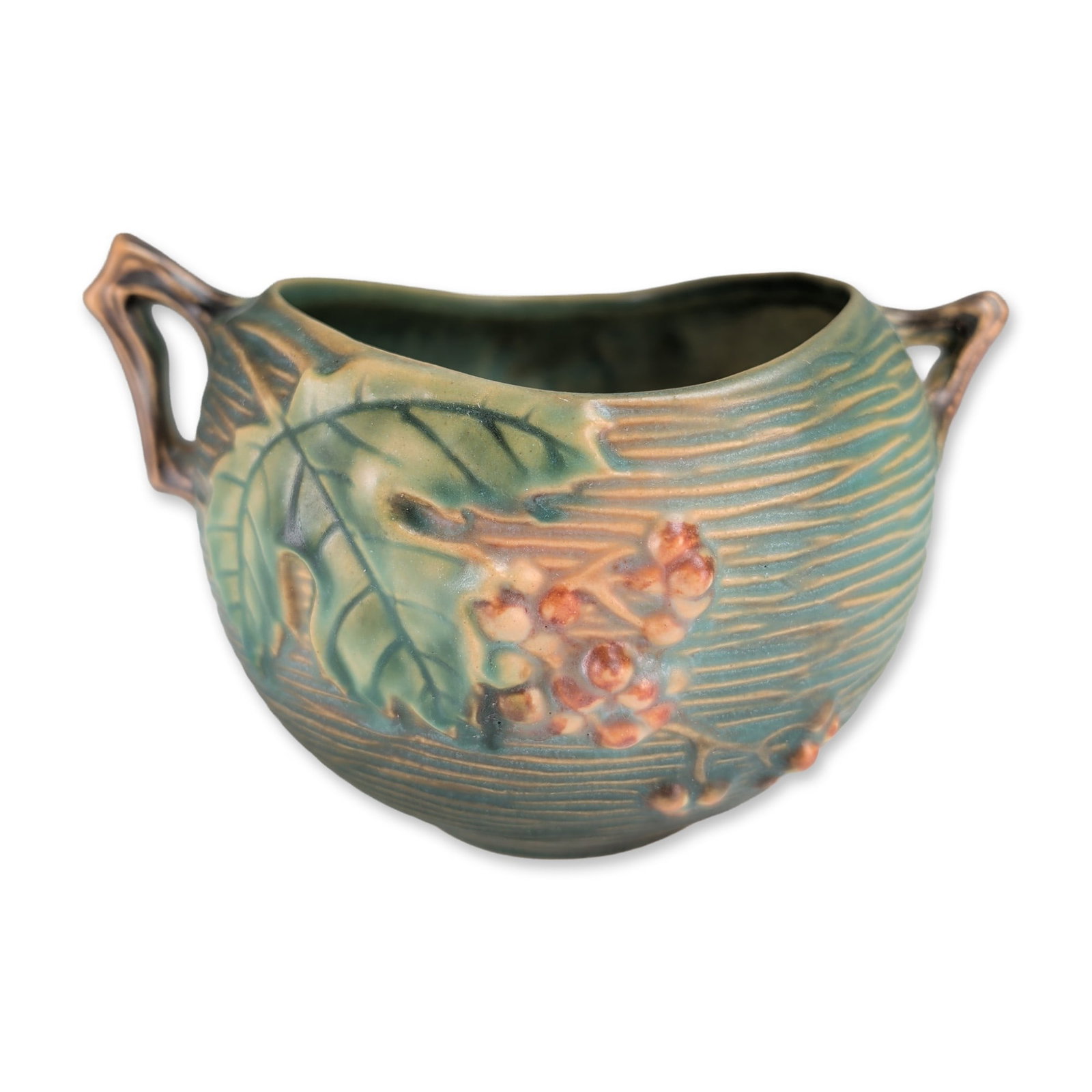 Roseville Bushberry Green Art Pottery Jardiniere: Roseville Pottery Company earthenware jardiniere in the Bushberry pattern, featuring a molded relief design of orange-red berries and serrated green leaves against a textured teal-green ground with ho