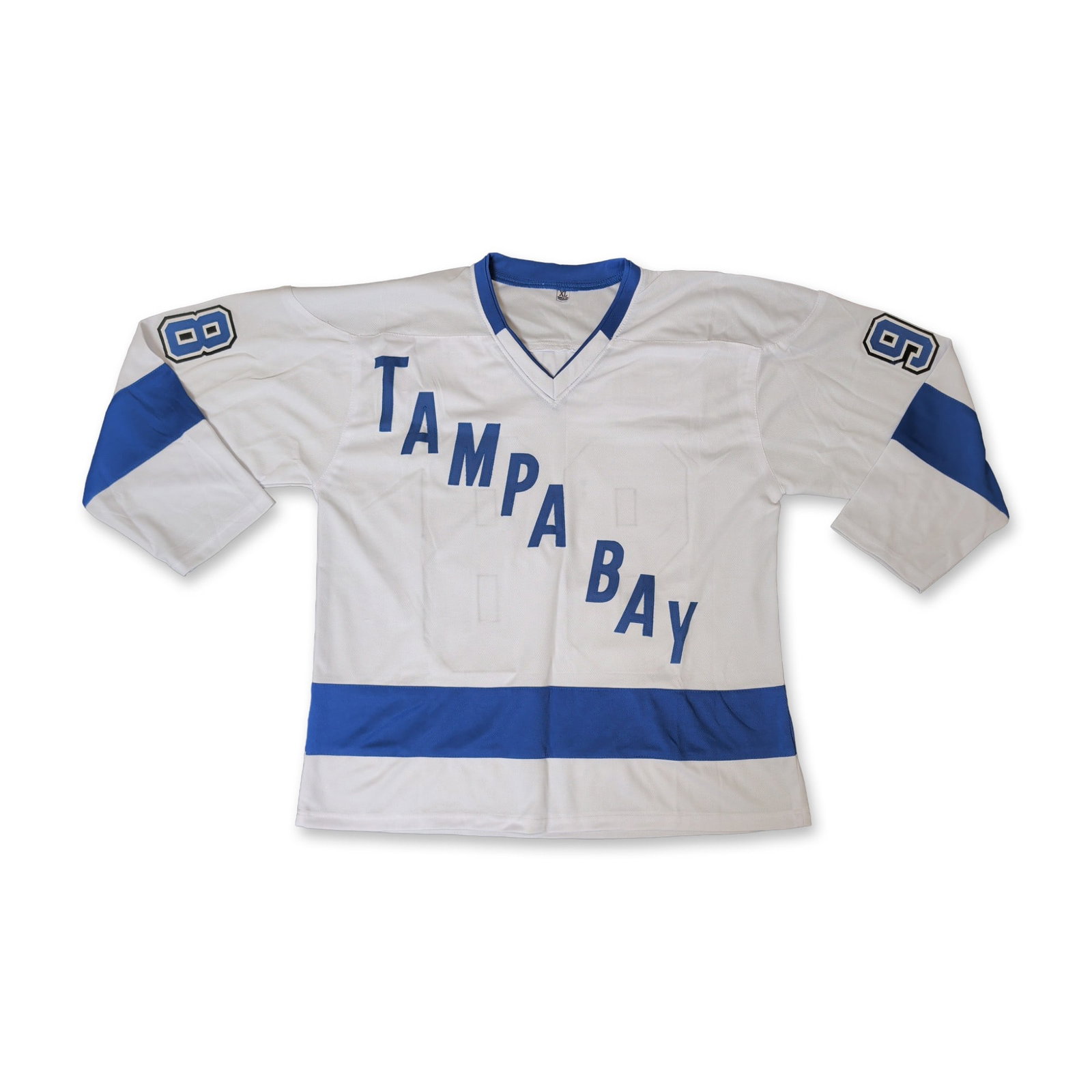 Mikhail Sergachev Autographed Tampa Bay Hockey Jersey: Custom-style white hockey jersey with blue and black accents, featuring the text TAMPA BAY applied diagonally to the front. The reverse displays the name SERGACHEV on a nameplate above the player numb