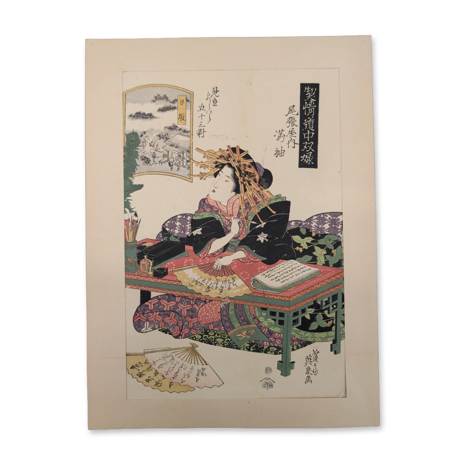 Keisai Eisen (Japanese, 1790-1848) Woodblock Print, Mitsusode of the Owariya House: An original 19th-century Japanese Ukiyo-e School woodblock print on paper depicting an Edo lady resting on a futon. The finely detailed scene shows the lady positioned behind a low table, holding a fa