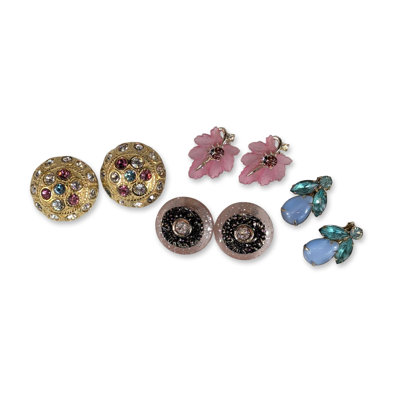 Collection of Four Pairs Vintage Costume Earrings: United States, mid-to-late 20th century. Collection of four pairs of costume earrings in various materials and styles. One pair features a cluster design with pear-shaped light blue cabochons and