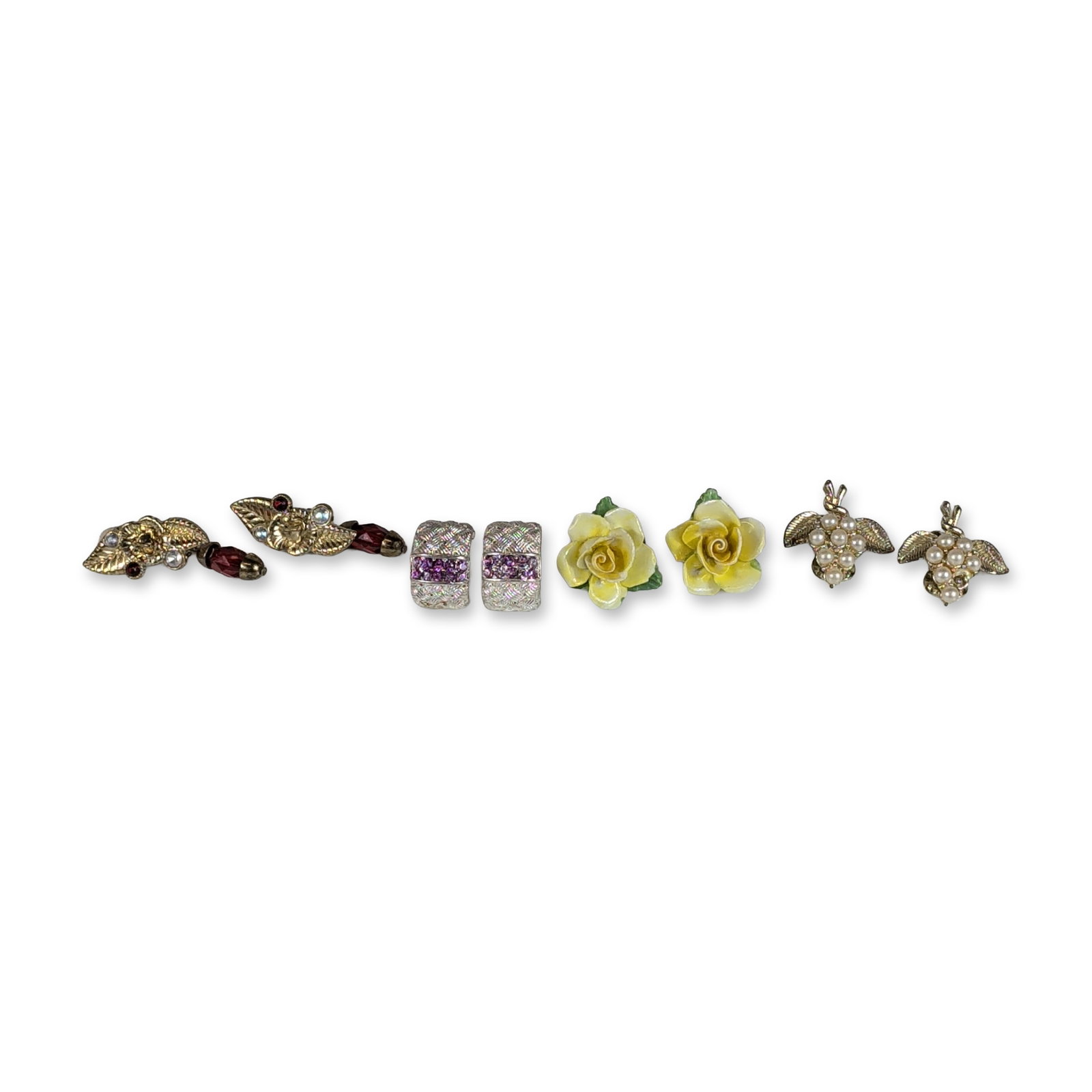 4 Pairs of Vintage Mixed Metal and Porcelain Clip-On Earrings: Group of four pairs of vintage costume clip-on earrings in assorted styles and materials. The collection includes a pair of gold-tone floral cluster earrings with faux pearls and textured leaves; a