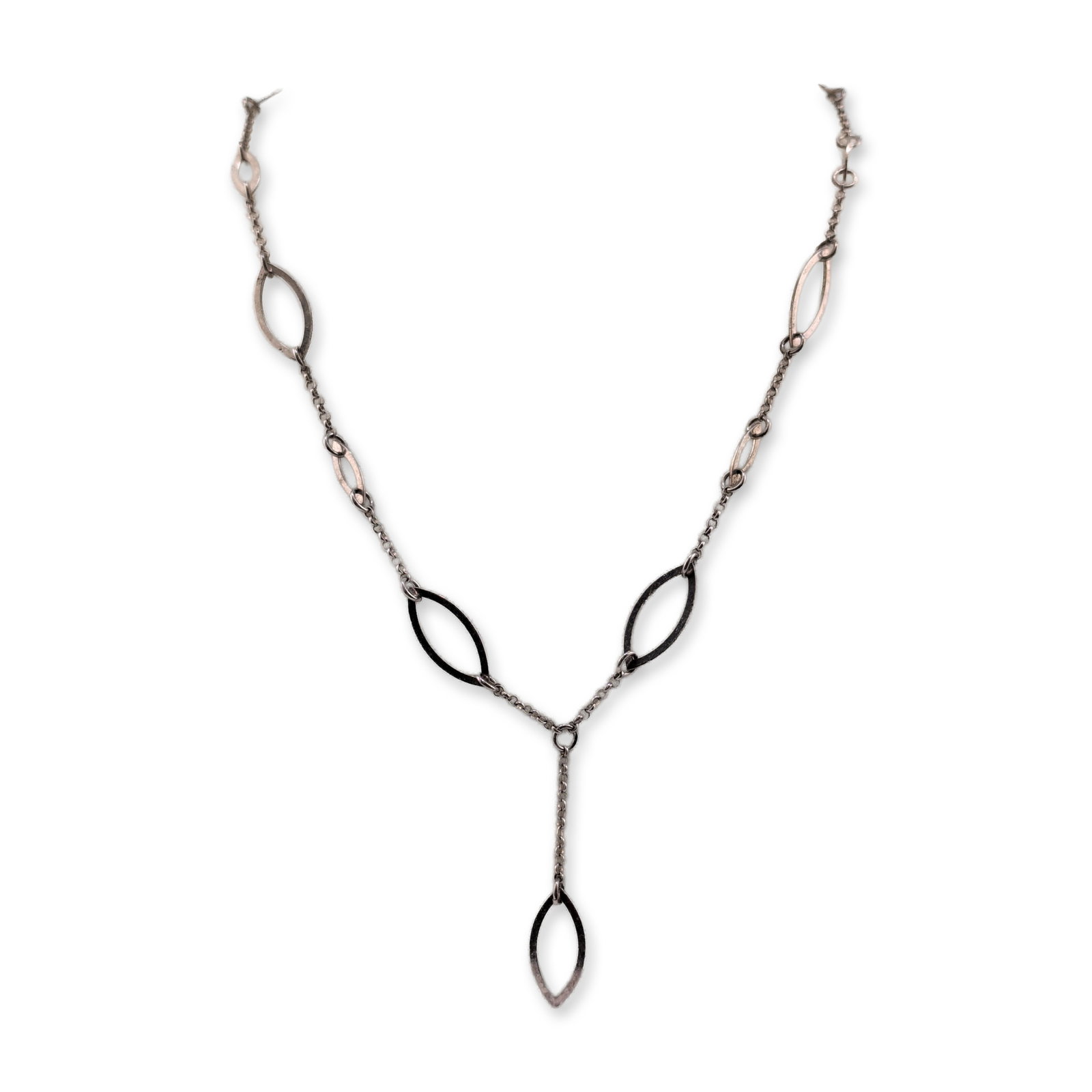 Sterling Silver Y-Style Open Marquise Station Necklace: Sterling silver Y-style station necklace featuring multiple open marquise-shaped stations of varying sizes. The decorative elements are connected by sections of fine cable chain leading to a central
