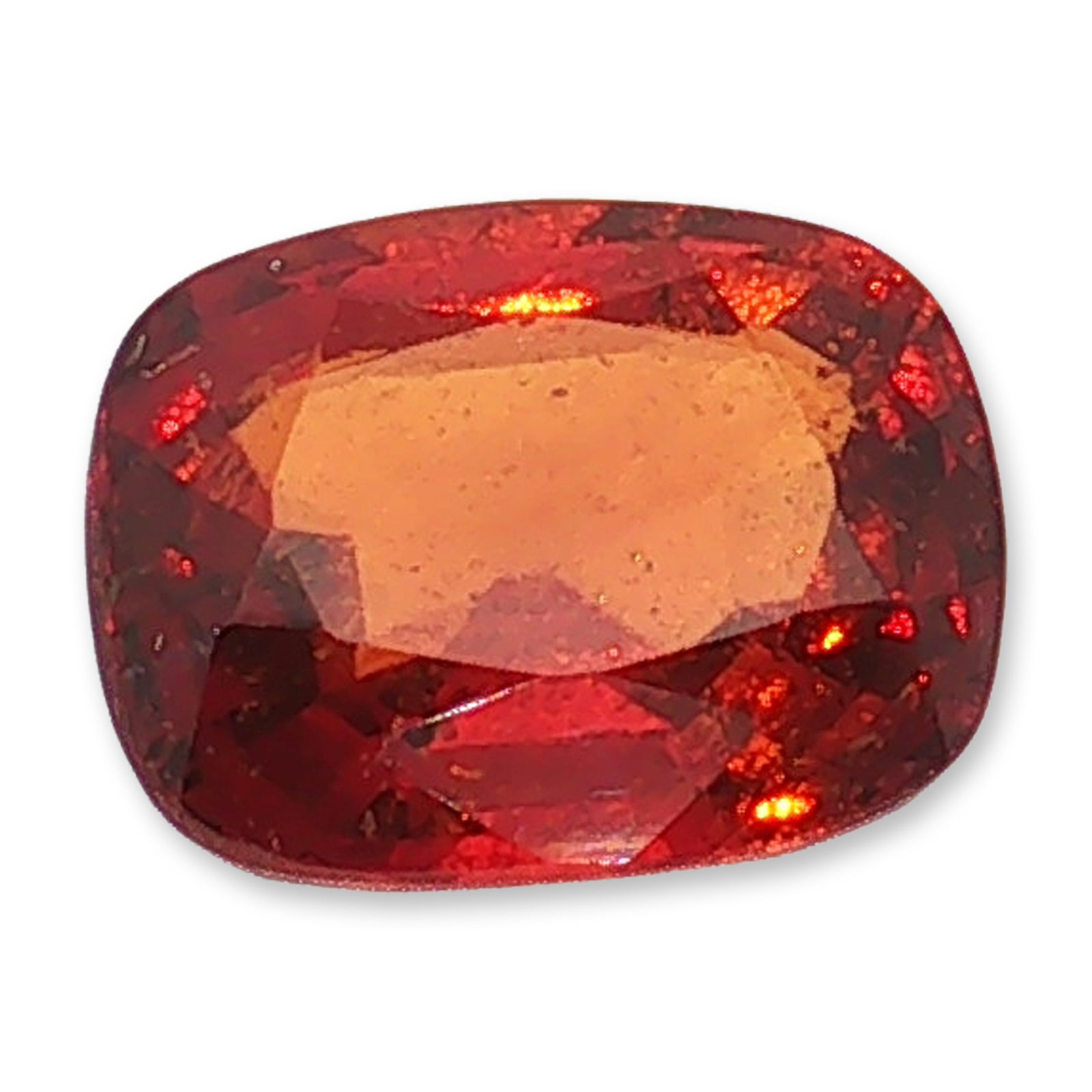 Loose Cushion Cut Red Hessonite Gemstone: A loose faceted hessonite gemstone, cushion cut. The stone features a rich, deep red hue with warm orange undertones and fiery internal reflections. The classic cushion shape highlights natural color 