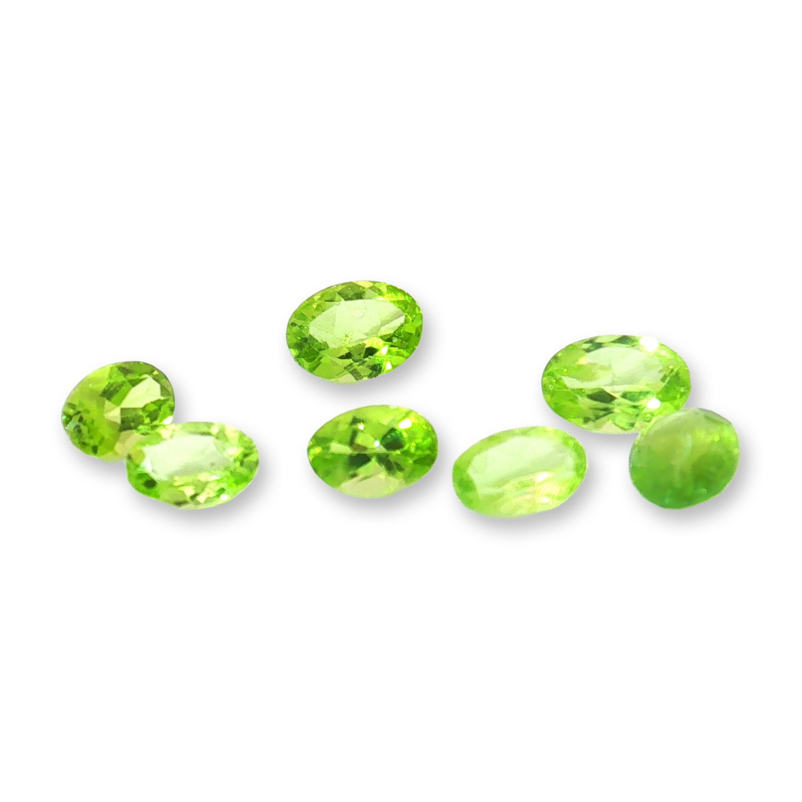 7pc Oval Peridot Gemstones: Beautiful grouping of 7 Peridot stones 0.40-0.70ctw. A green peridot is a vibrant, August birthstone renowned for its unique single-color profile"ranging from bright lime to deep olive green. Tested