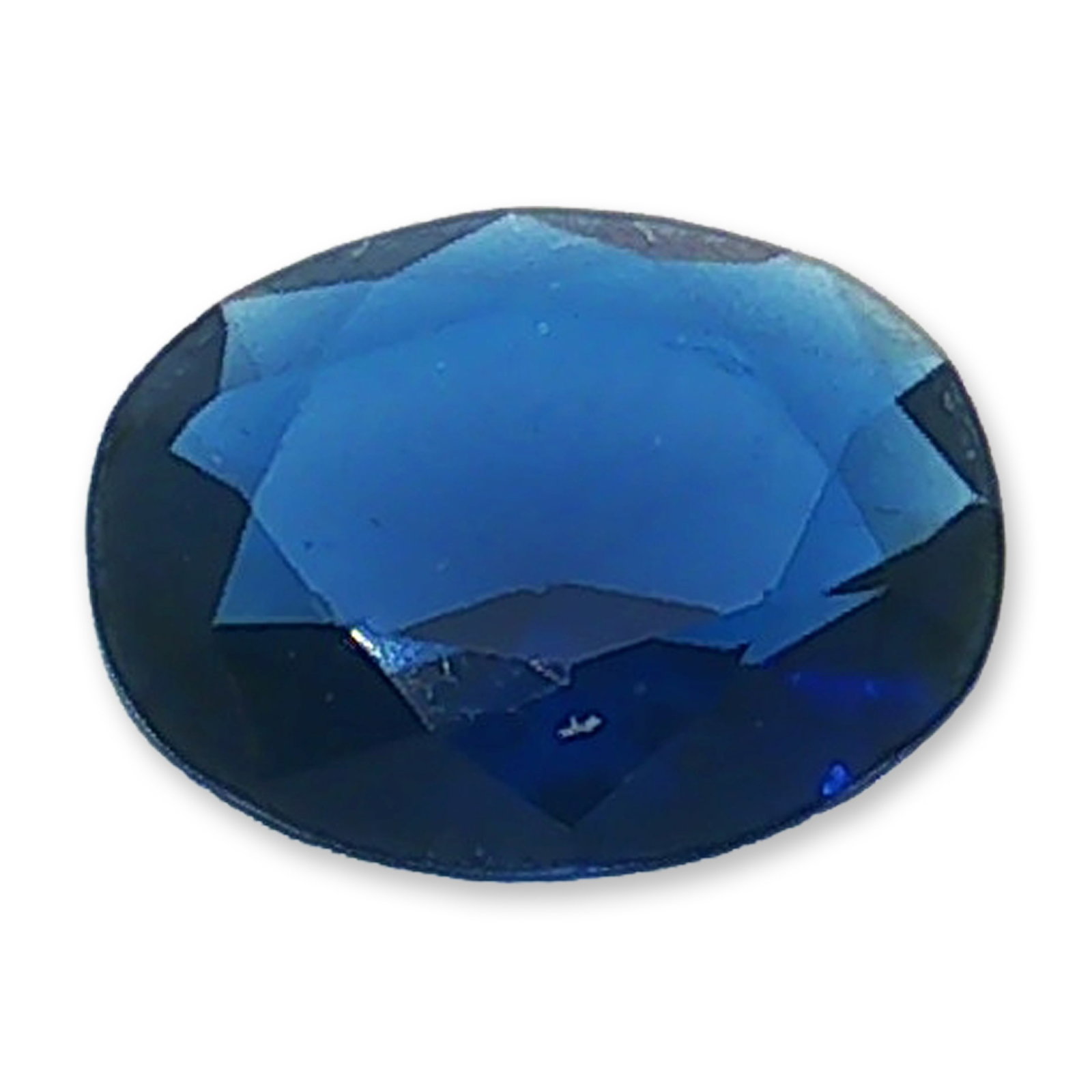 Oval Cut Royal Blue Loose Iolite: Loose faceted gemstone appearing to be iolite, featuring a saturated royal blue hue and a deep, rich color profile. The stone is cut in an oval shape with facets designed to catch and reflect light