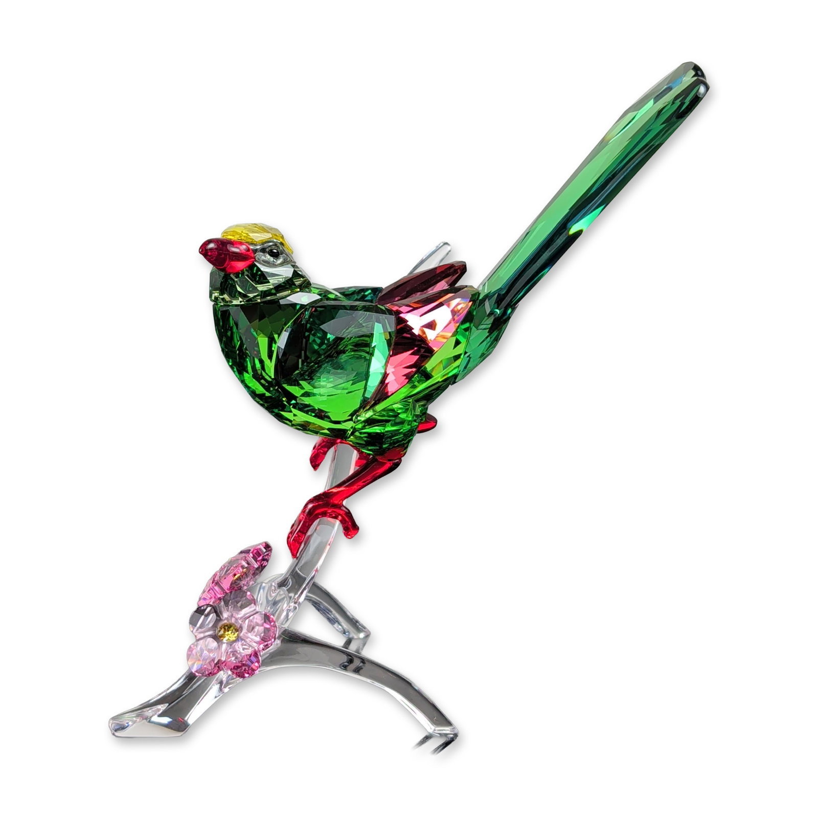 Swarovski Green Magpie Crystal Bird Figurine: Swarovski Green Magpie figurine, model 44650, in faceted lead crystal, featuring a green body with red and yellow head details perched on a clear crystal flowering branch. The composition includes two