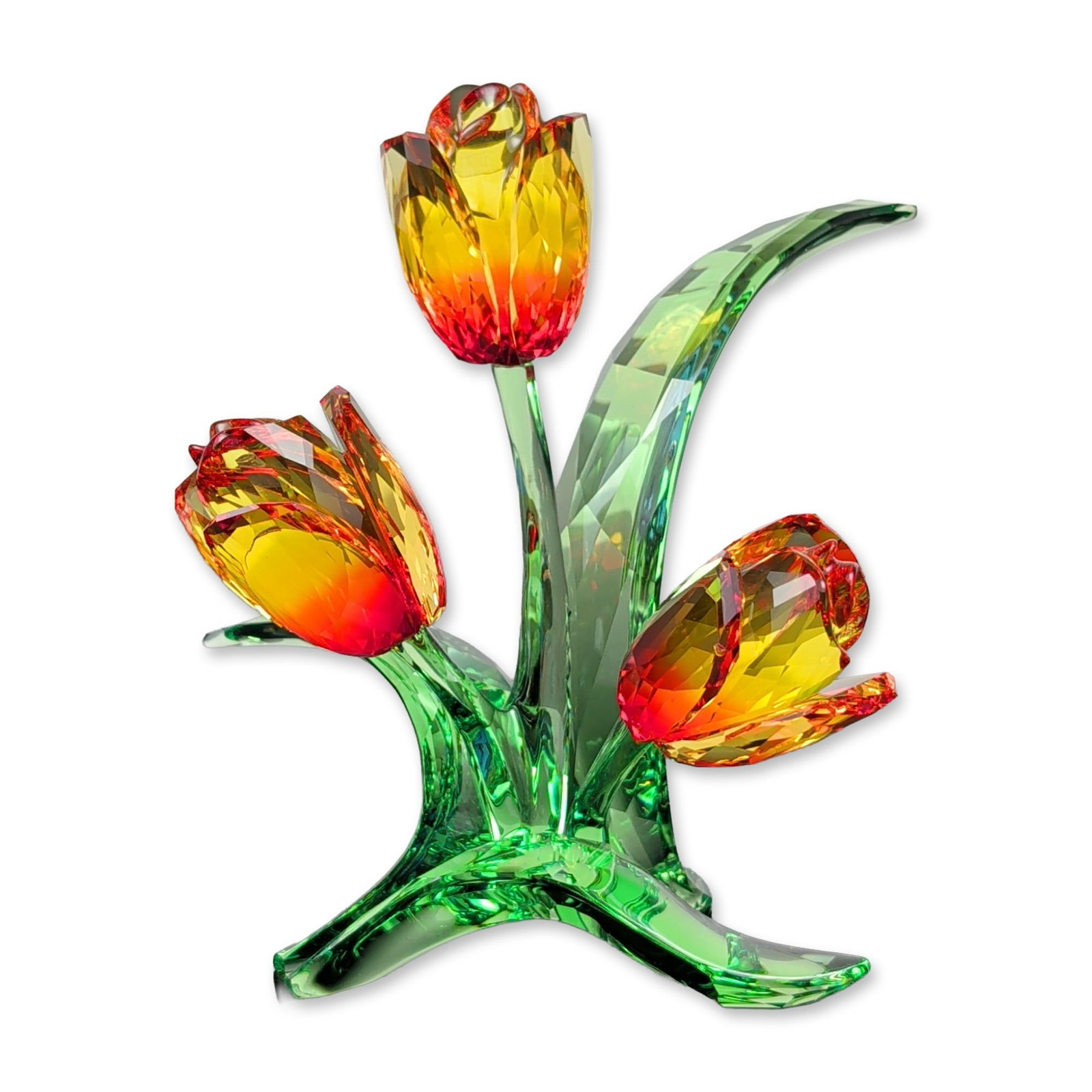 Swarovski Crystal Tulips Figurine: Swarovski. Crystal flower figurine, model 5302530, depicting a trio of tulips. The blossoms are crafted from faceted crystal featuring a color gradient transitioning from yellow at the tips to red at 