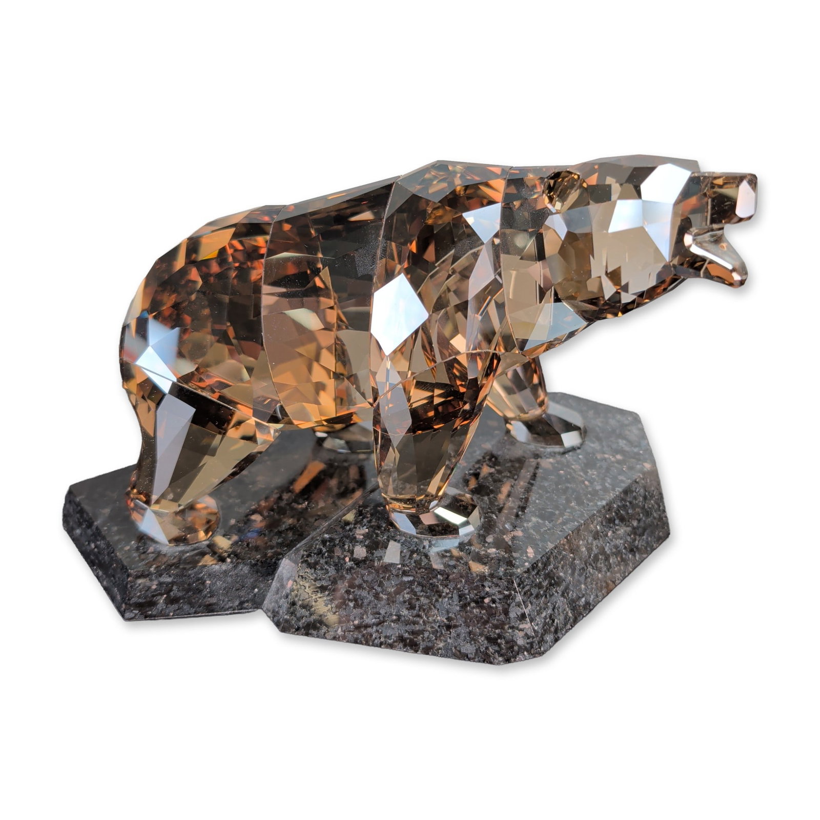 Swarovski Soulmates Series Golden Teak Crystal Bear Figurine: Swarovski Soulmates series faceted crystal bear constructed from Golden Teak translucent faceted crystal, mounted to two separate hexagonal bases of polished dark grey granite. This piece includes the