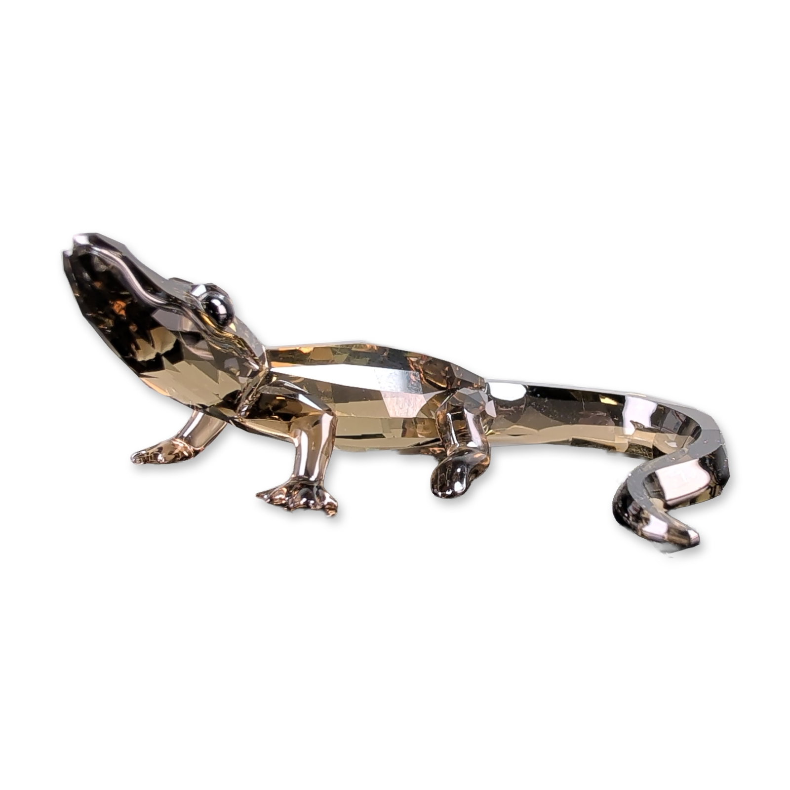Swarovski SCS Crystal Baby Crocodile Figurine: Swarovski Baby Crocodile figurine in multi-faceted lead crystal, featuring a smoky tones. Made for the SCS members as the 2016 Event Piece and designed by Elisabeth Adamer, the figure features black c