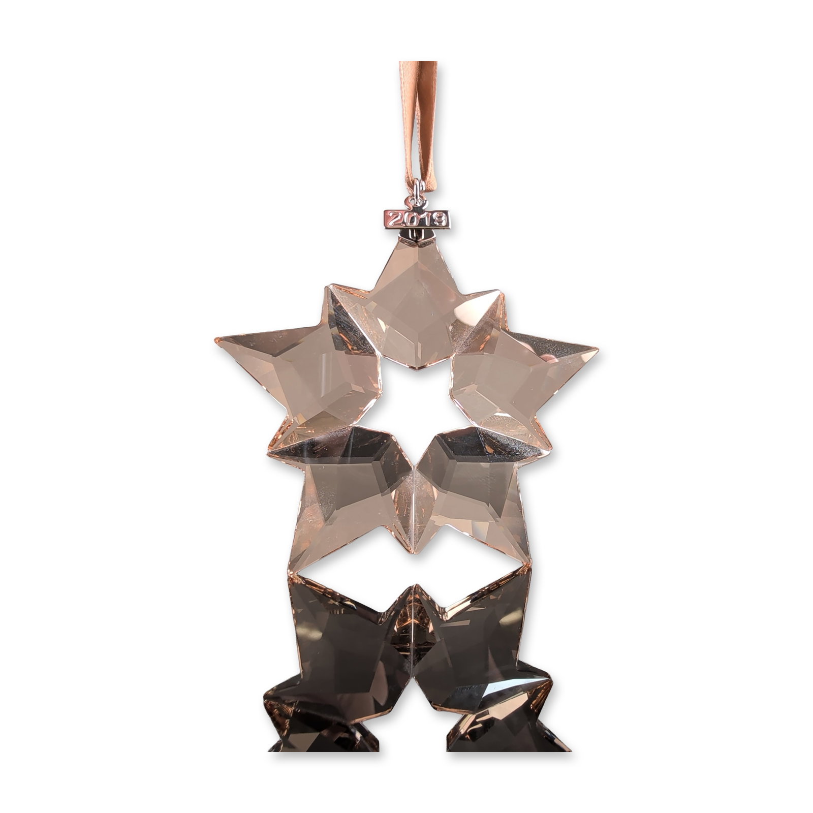 Swarovski 2019 Annual Edition Golden Shadow Star Ornament: Swarovski Annual Edition 2019 holiday ornament in faceted Golden Shadow crystal. The design features five individual star-shaped components joined to form a central pentagonal star motif. The ornament