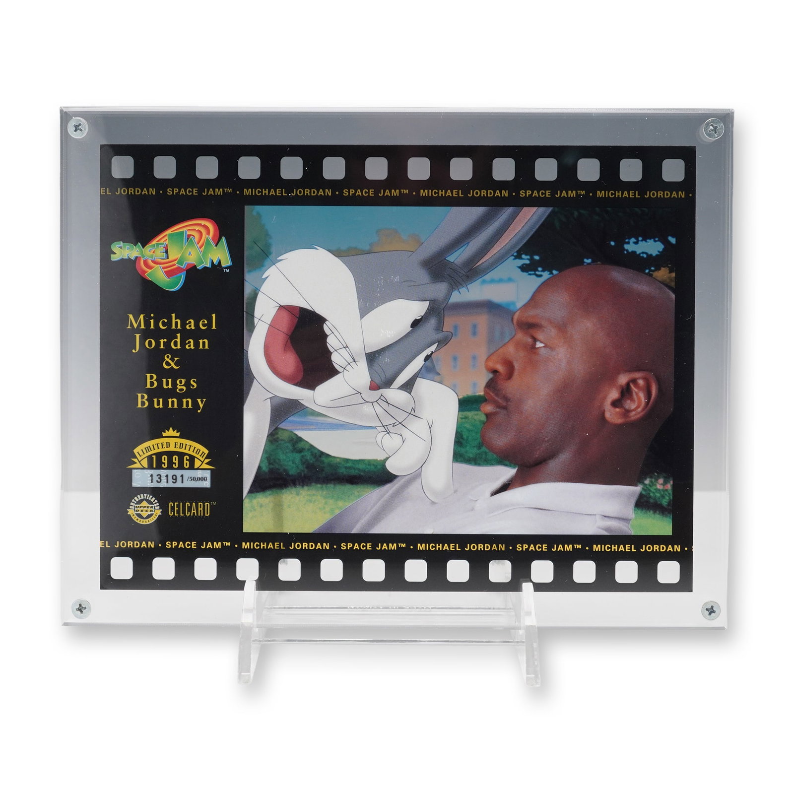 1996 Upper Deck Space Jam Michael Jordan CelCard: 1996 Upper Deck CelCard featuring an animation cel-style image from the motion picture Space Jam, depicting Michael Jordan and Bugs Bunny. The card is designed with a black filmstrip border repeating