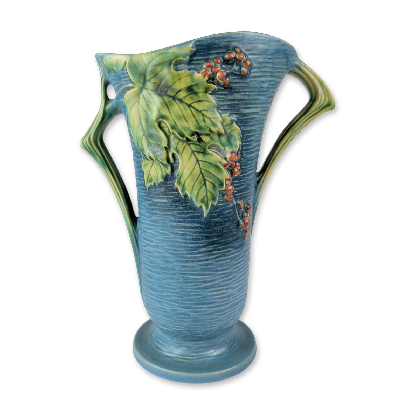 Roseville Pottery Art Deco Bushberry Blue Double-Handled Vase: American art pottery handled vase produced by Roseville Pottery in the Bushberry pattern, introduced circa 1940. The earthenware vessel features a textured blue ground with horizontal ridging and mold