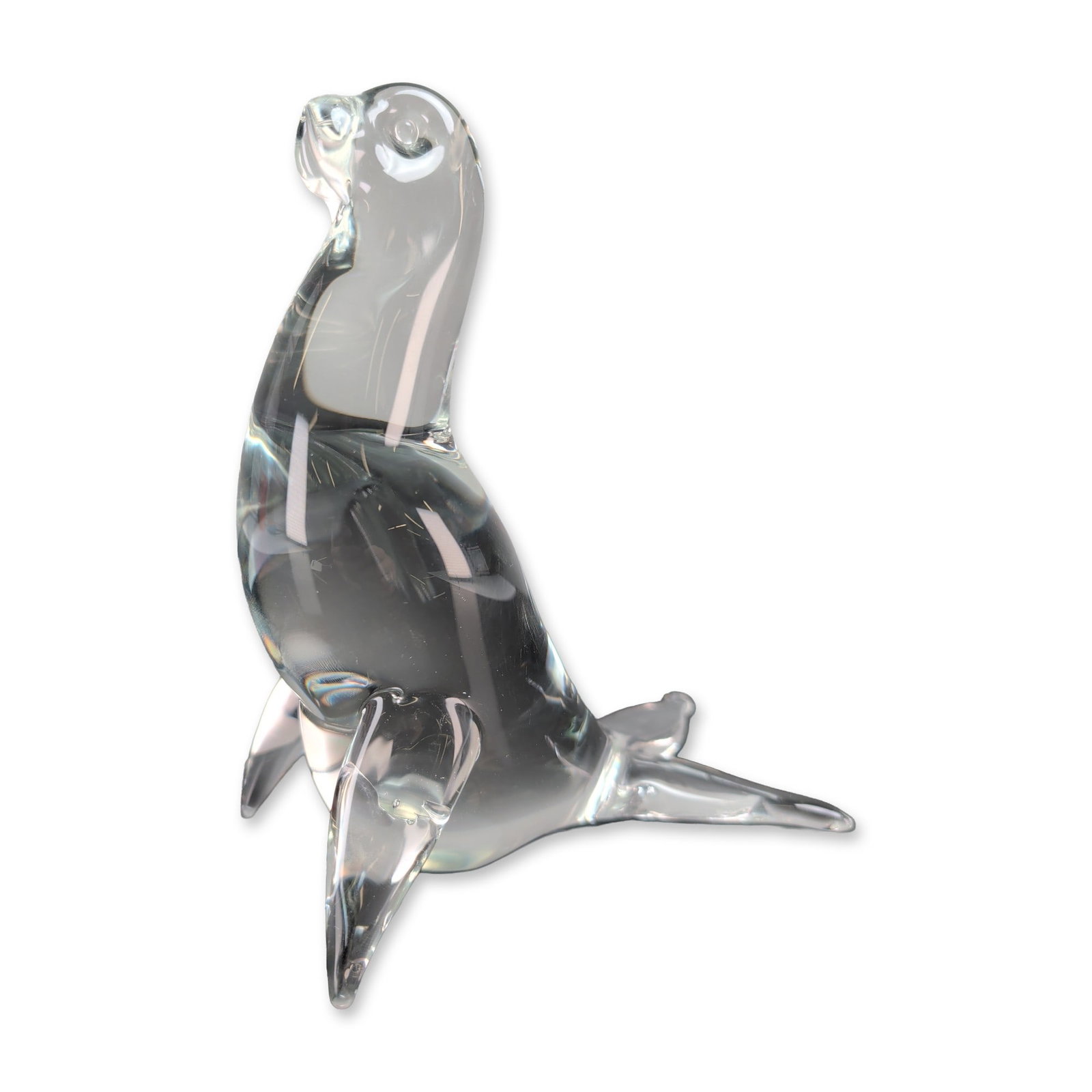 Licio Zanetti Murano Glass Signed Seal Figurine: A clear glass stylized seal figurine, featuring an arched body with four extended flippers and an upturned head. The solid colorless glass is finished with smooth contours and small indentations