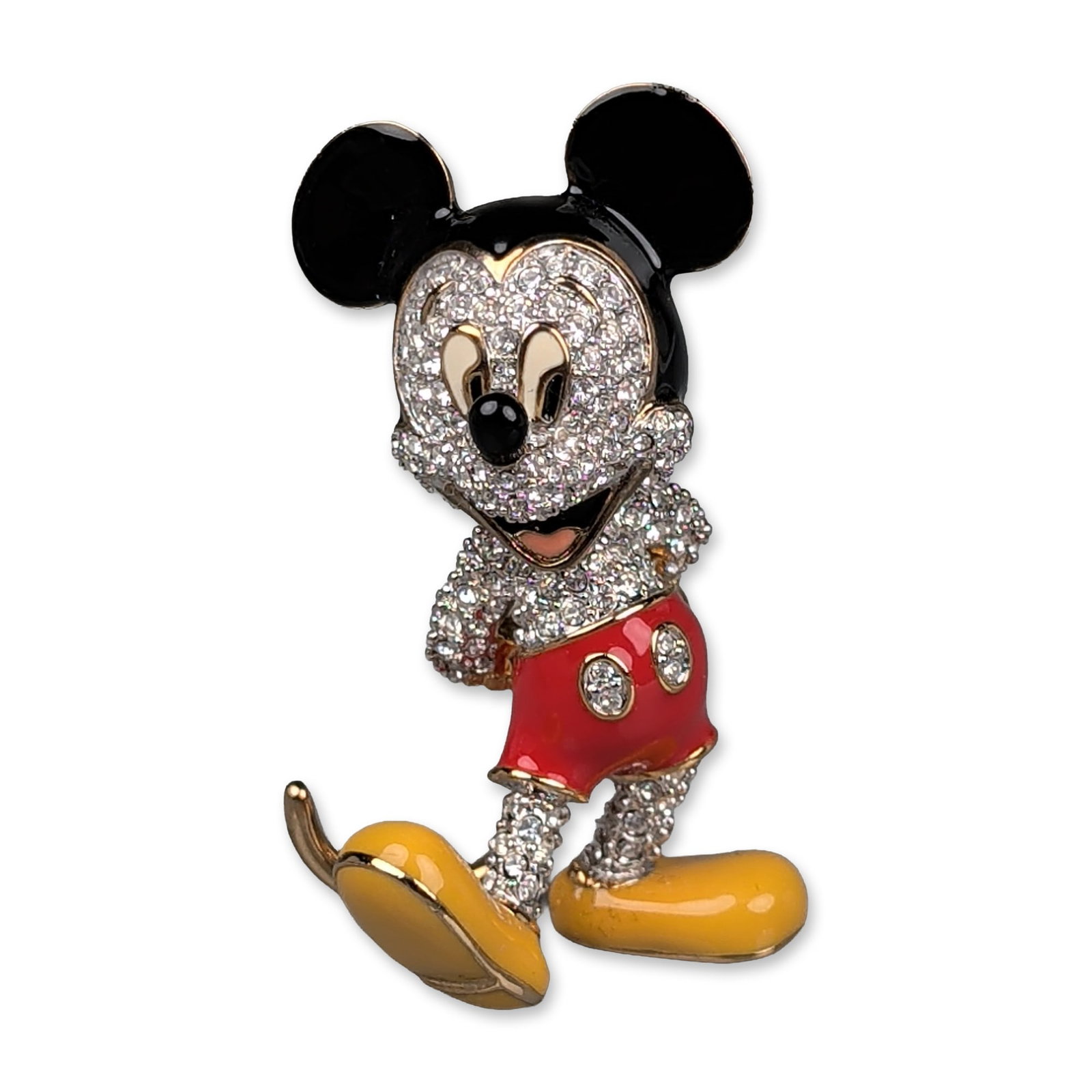 Arribas Brothers Disney Swarovski Jeweled Mickey Mouse Figurine: Arribas Brothers Disney collection brooch of Mickey Mouse in a standing pose. The figure is constructed from gold-tone metal, featuring clear round faceted crystals in a dense pave setting across the
