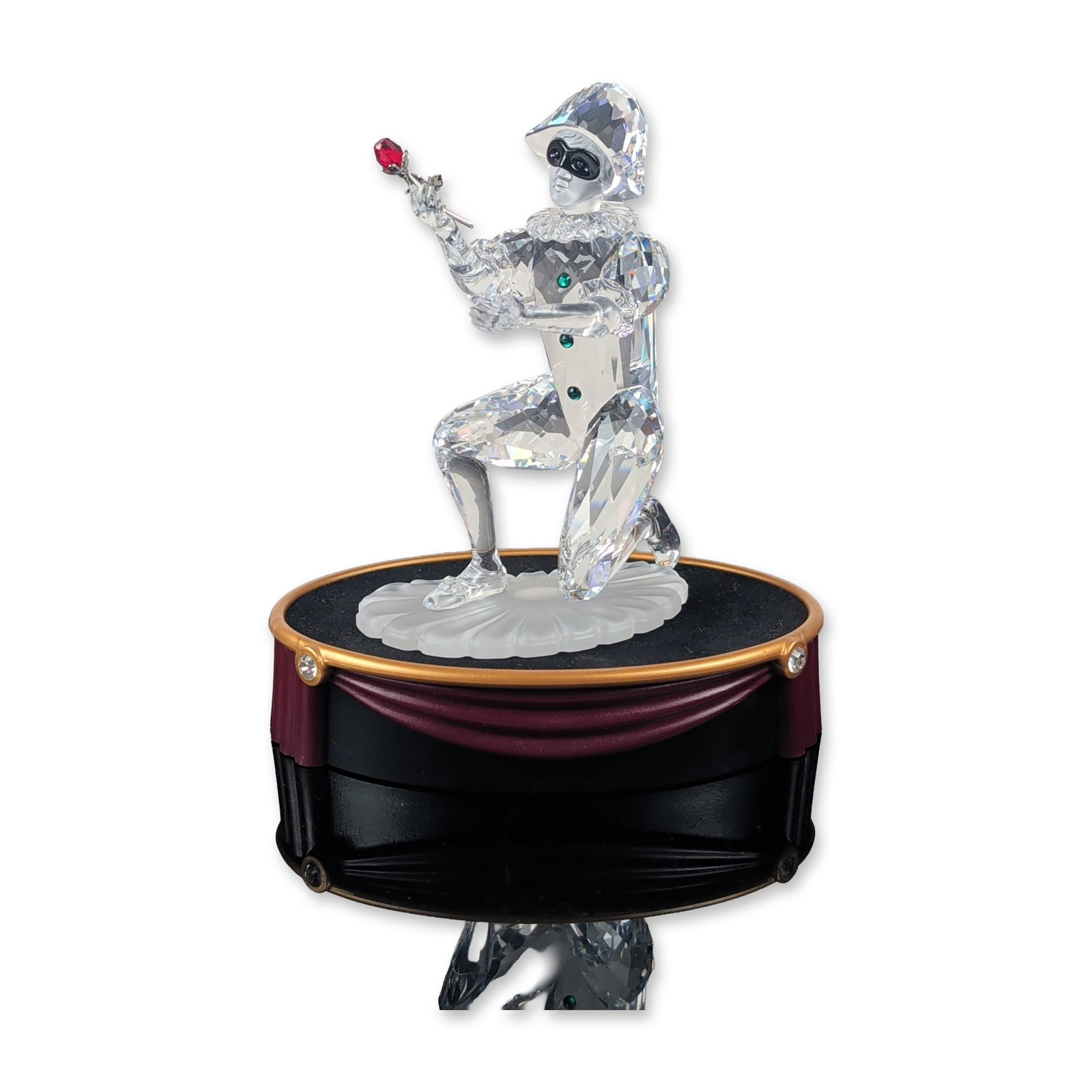 Swarovski 2001 SCS Harlequin Crystal Figurine: Austrian, 2001 Swarovski Crystal Society annual edition figurine titled Harlequin. Faceted clear lead crystal figurine featuring a black crystal mask, three green crystal chest buttons, and a red