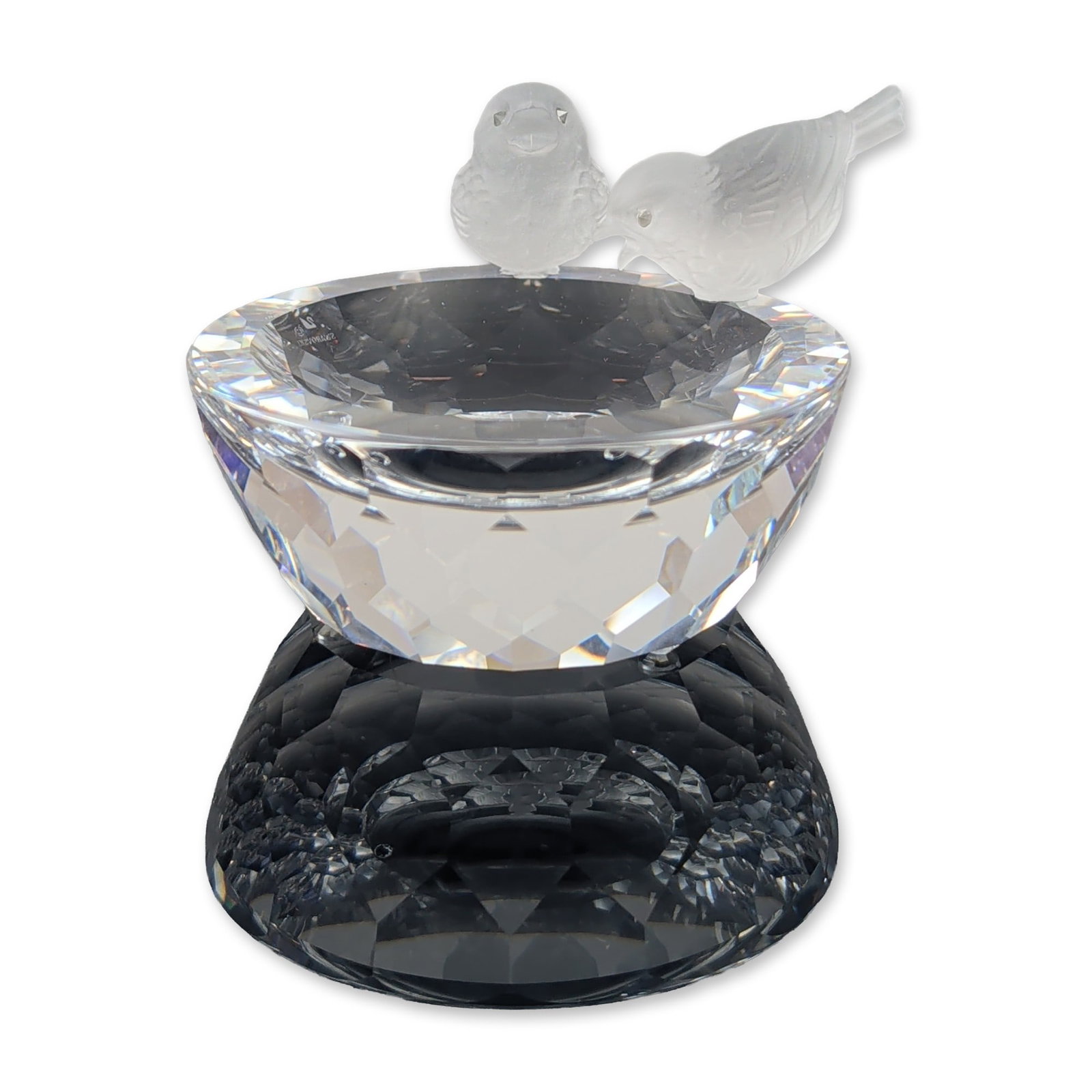Swarovski Crystal Frosted Bird Bath Figurine: Swarovski. Bird bath figurine in lead crystal, featuring two frosted birds perched upon a clear, multi-faceted crystal bowl. The underside of the rim bears an etched mark consisting of a stylized swan