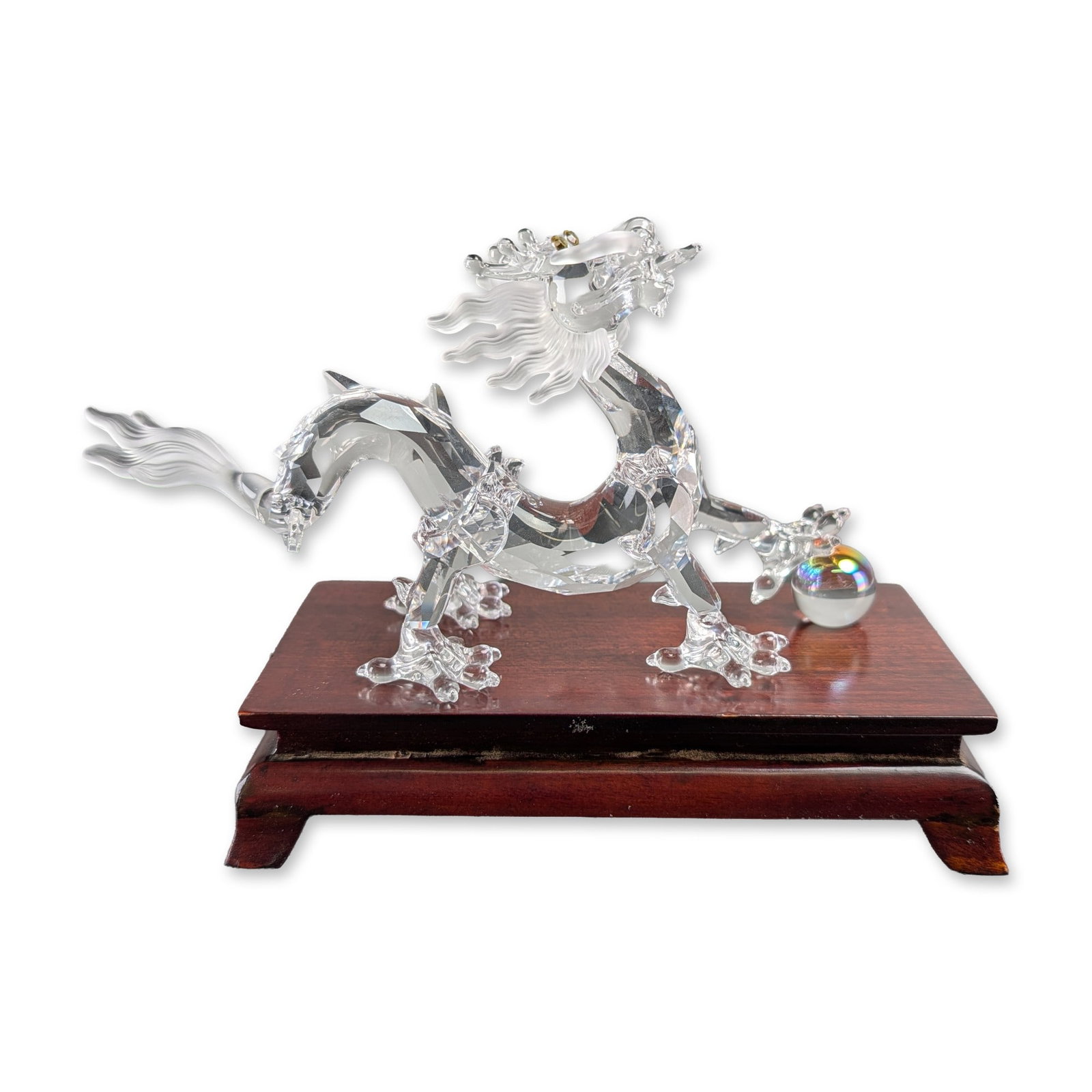 Swarovski Crystal Zodiac Dragon Figurine: Swarovski Silver Crystal dragon figurine, modeled as a traditional Chinese dragon in a serpentine pose. The faceted lead crystal body is accented with frosted crystal for the mane, whiskers, and tail 