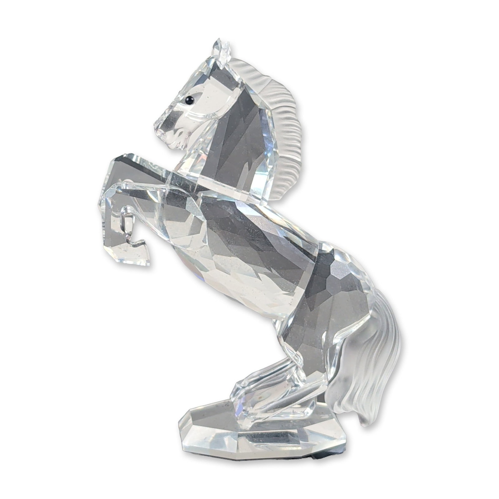 Swarovski Silver Crystal White Stallion: Swarovski Silver Crystal. White Stallion horse figurine in faceted and frosted lead crystal. An etched swan symbol is present on the underside of the faceted base. The piece is accompanied by its orig