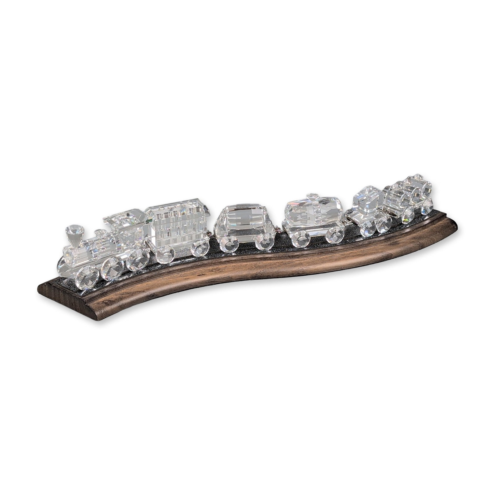 7pc Swarovski Silver Crystal Express Six-Piece Train Set plus Track: Swarovski Silver Crystal Express train set comprising six faceted clear lead crystal miniatures with rhodium-plated metal connectors and a specialized display base. The collection includes a locomotiv