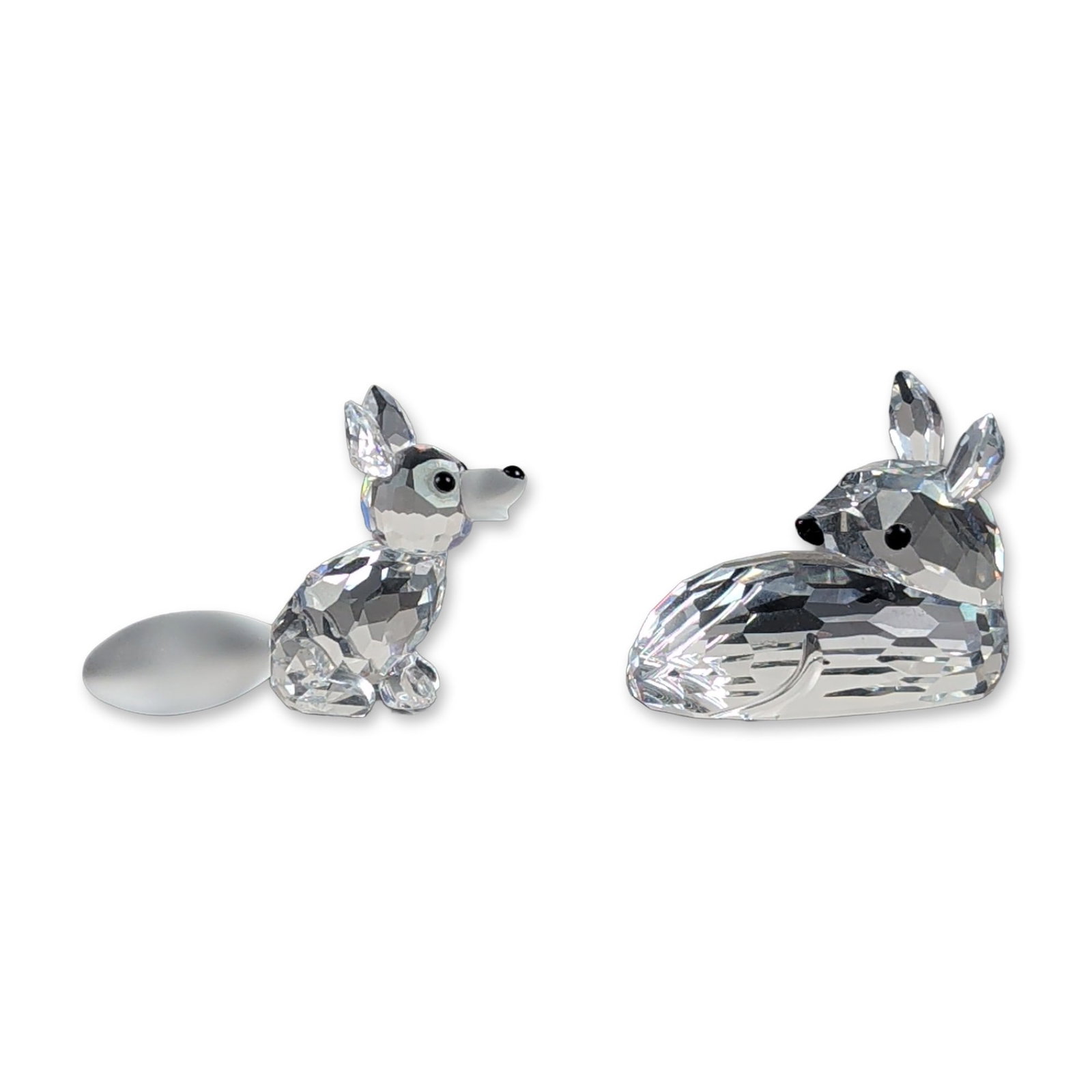 2pc Swarovski Silver Crystal Woodland Friends Animal Figurines: This grouping features two miniature animal figurines from the Swarovski Silver Crystal Woodland Friends collection, crafted from faceted Austrian lead crystal. The roe deer fawn features a multi-face