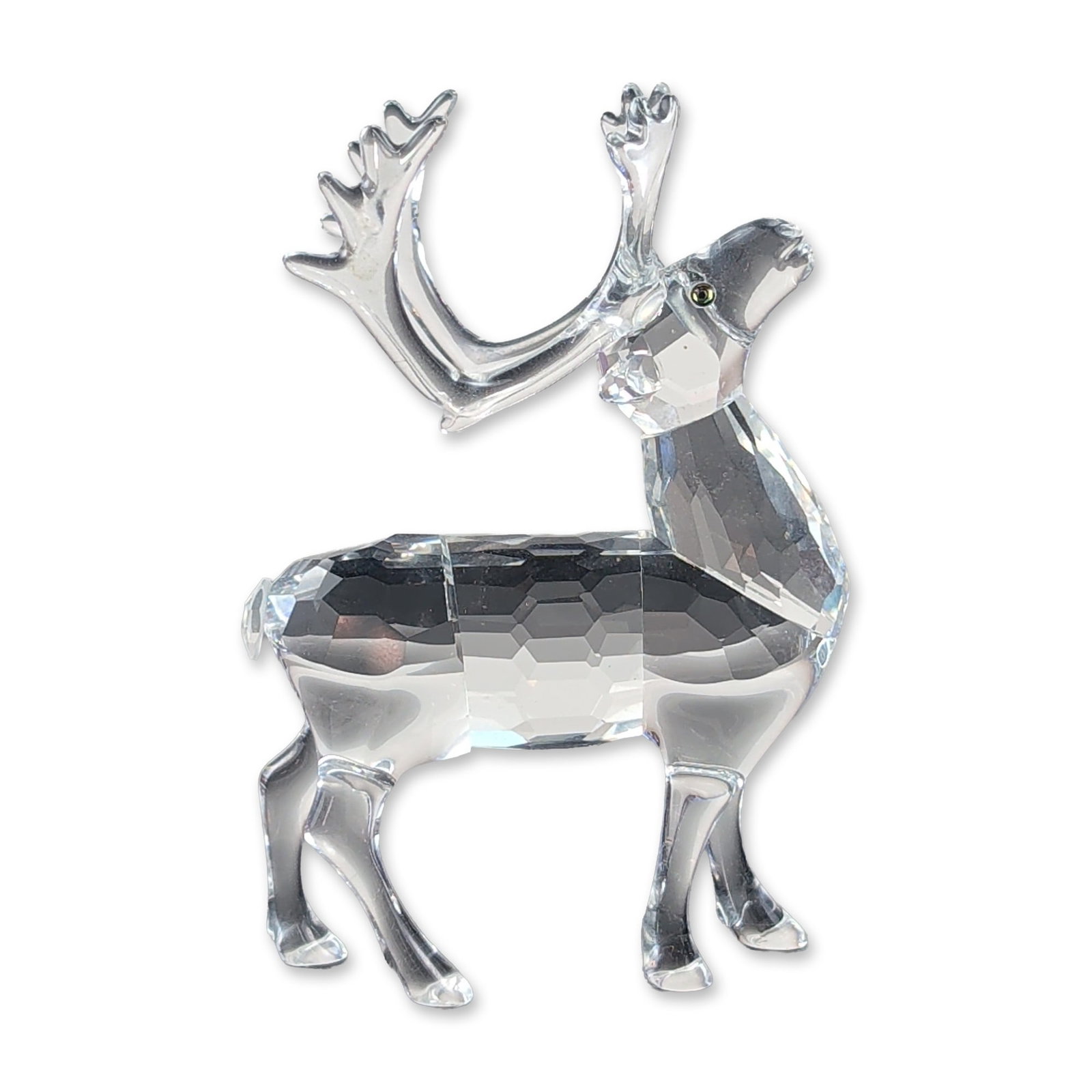 Swarovski Silver Crystal Reindeer Figurine: Swarovski Silver Crystal reindeer figurine in faceted and smooth lead crystal, featuring a faceted body and neck with smooth limbs and a single remaining antler. The head is detailed with small dark i