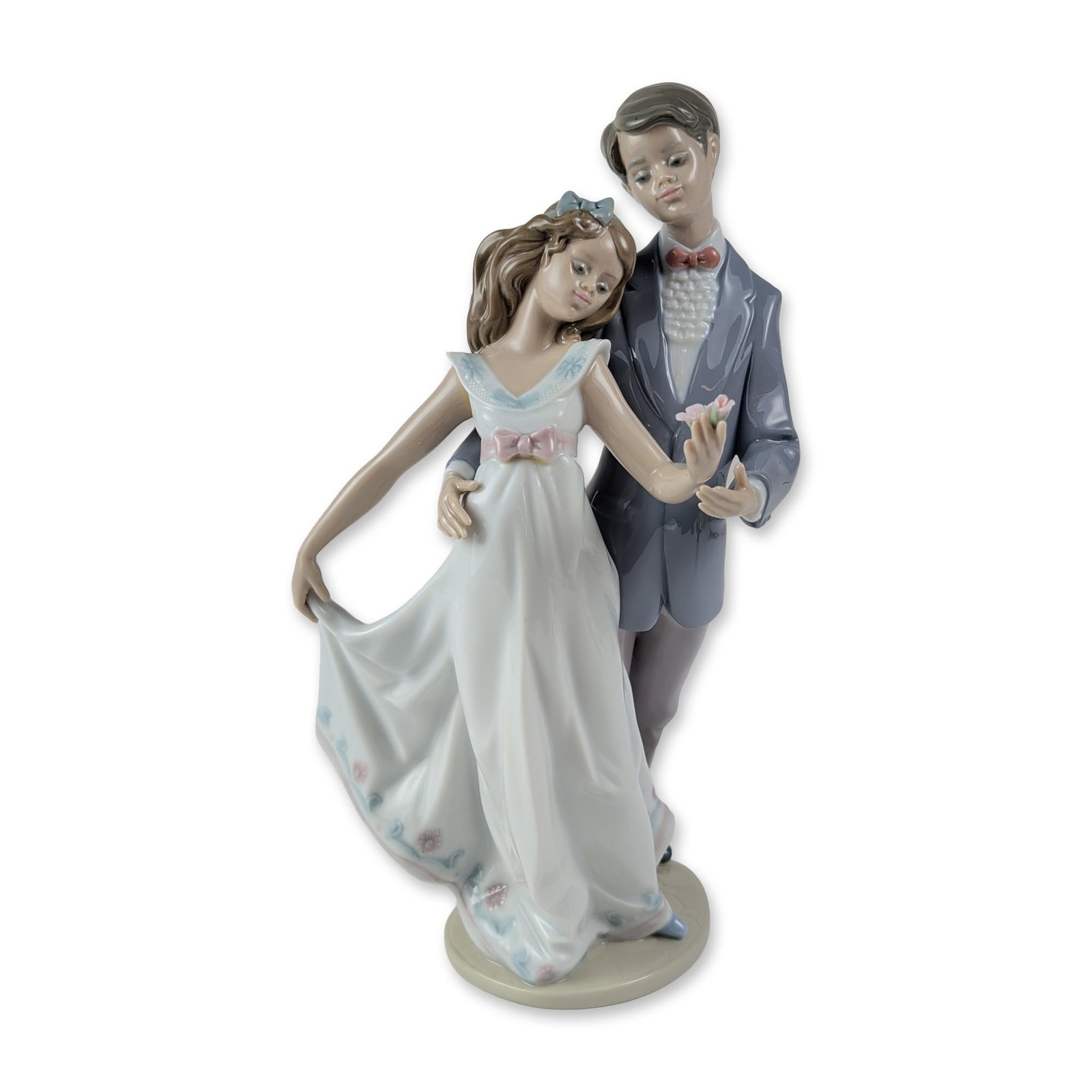 Lladro Spanish Porcelain Now and Forever Figurine 1007642: Lladro Spanish glazed porcelain figurine titled Now and Forever, model number 1007642, designed by sculptor Francisco Polope. The piece depicts a young couple in formal attire engaged in a dance. The 