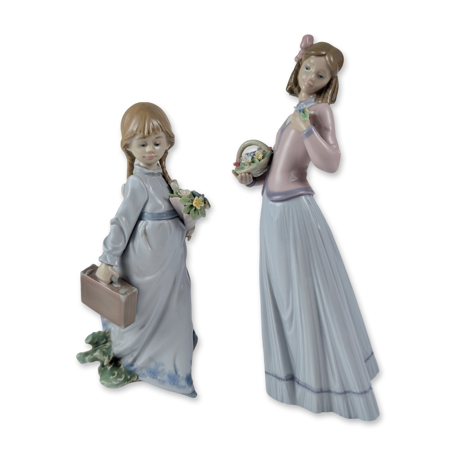 2pc Lladro Collector Society Figurines 1007644 & 1007604: Lladro glazed porcelain figurines, including Innocence in Bloom number 1007644 and School Days number 1007604. The taller figure depicts a young girl wearing a pink hair bow, lavender top, and blue pl