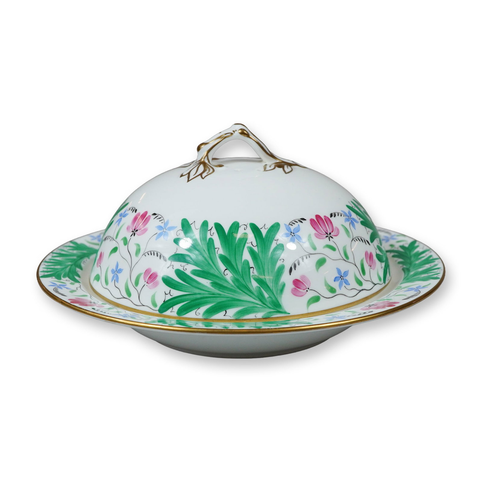 Wedgwood Hand-Painted Porcelain Covered Muffin Dish and Stand: A Wedgwood porcelain covered muffin dish of circular form with a matching underplate. The domed lid features three small steam vent holes and is surmounted by a handle modeled as a stylized gilt twig.
