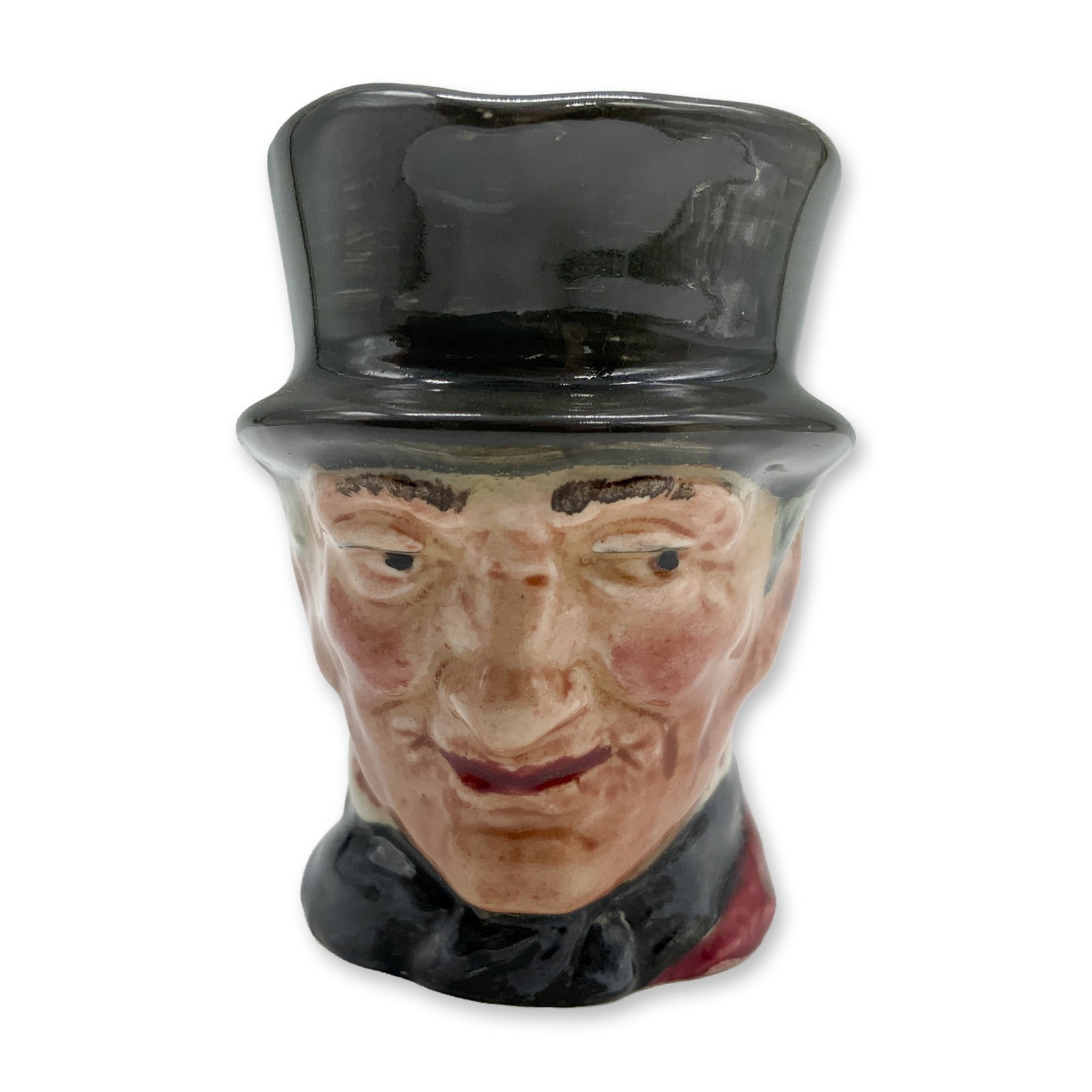 John Peel D6130 - Mini - Royal Doulton Character Jug: Variation One, grey handle. Dark grey hat; maroon coat; dark blue bow tie; grey riding crop. Royal Doulton backstamp. Artist: Harry Fenton Dimensions: 2.25"H Date or Era: 1940 - 1960 Manufacturer or B