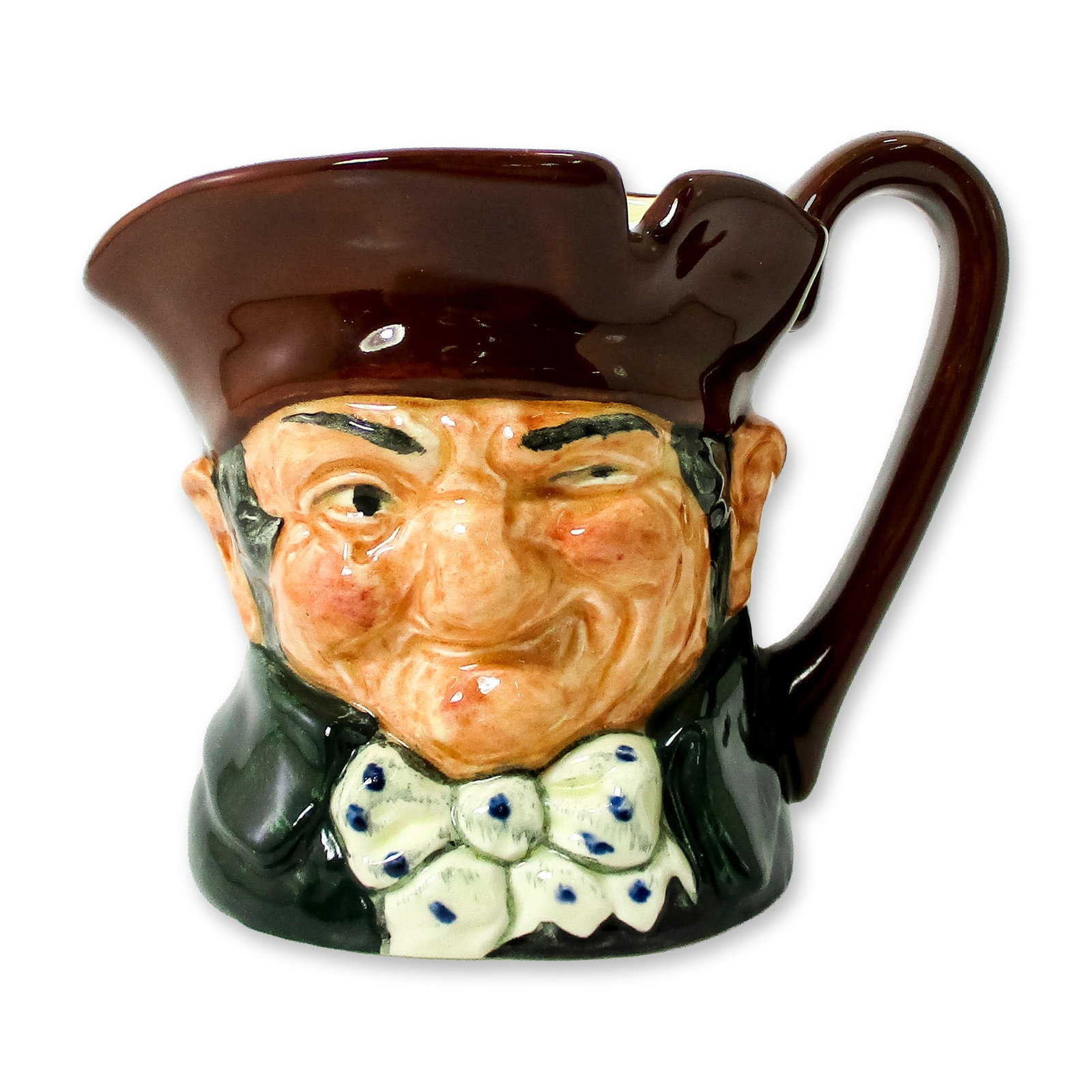 Old Charley D5527 - Small - Royal Doulton Character Jug: Brown hat; dark green coat; blue polka- dot bow tie. Royal Doulton backstamp. Artist: Charles Noke Dimensions: 3.25"H Date or Era: 1935 - 1983 Manufacturer or Brand: Royal Doulton Country of Origi