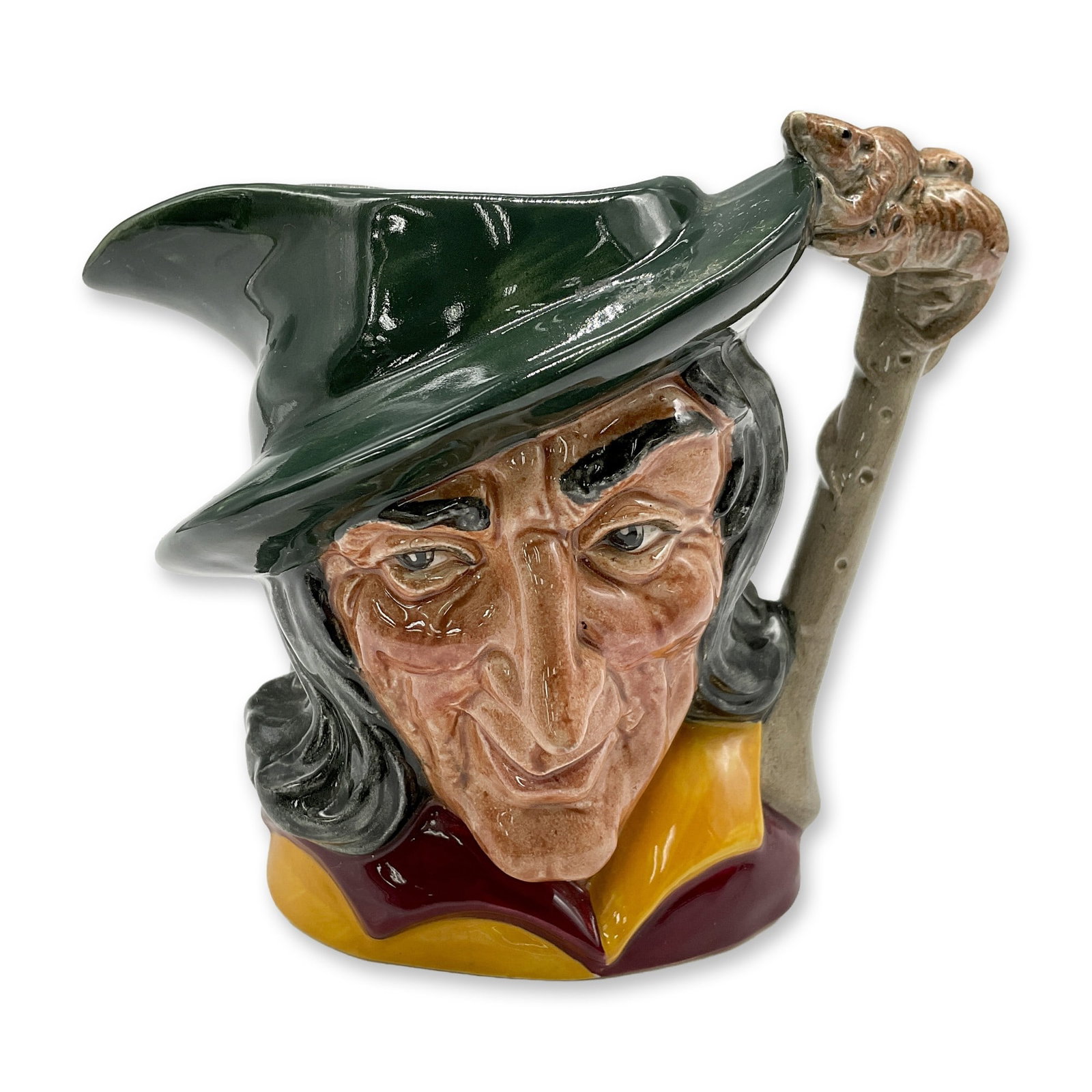 Pied Piper D6462 - Small - Royal Doulton Character Jug: Green cap; maroon and yellow tunic; brown hair. Royal Doulton backstamp. Artist: Geoff Blower Dimensions: 3.75"H Date or Era: 1957 - 1981 Manufacturer or Brand: Royal Doulton Country of Origin: <