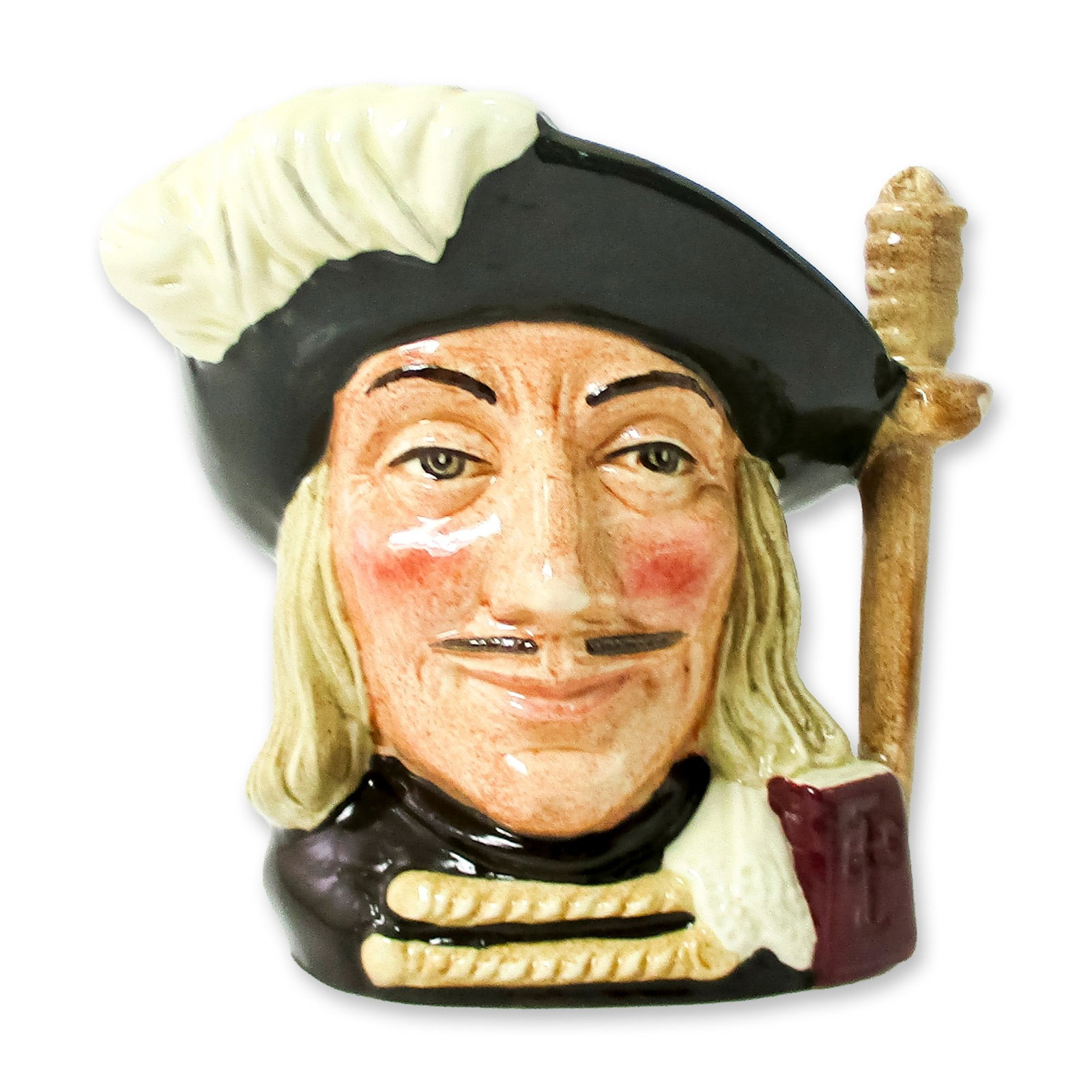Porthos D6453 - Small - Royal Doulton Character Jug: Variation One. Black hat; red cloak; black hair and moustache. One of the much-loved three musketeers in the 1844 novel by Alexandre Dumas, Porthos roamed Europe with his merry band in search of adven