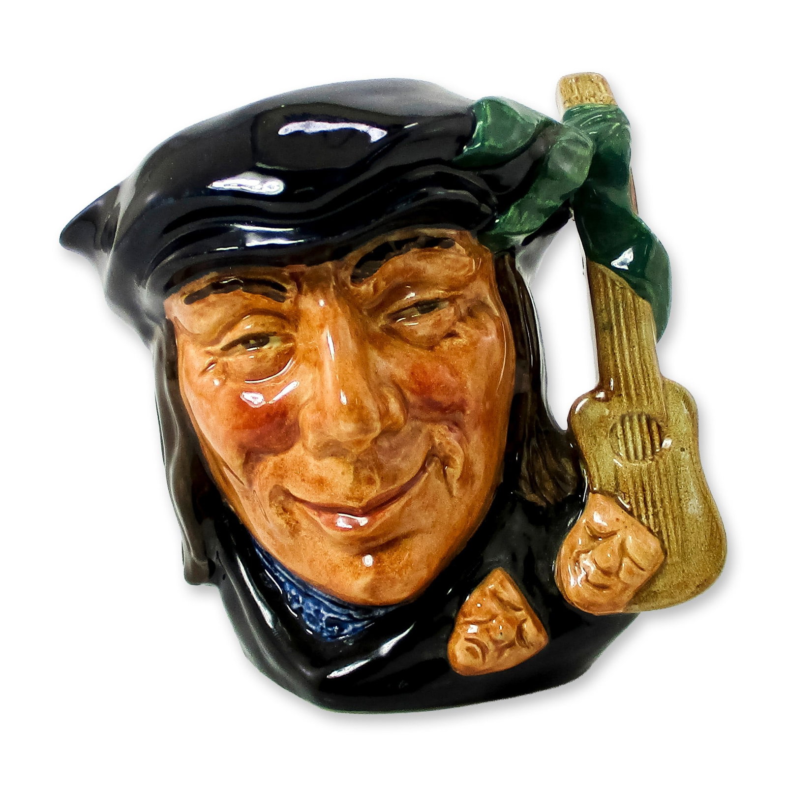 Scaramouche D6561 - Small - Royal Doulton Character Jug: Style One. Blue-black, brown, and green coloration. In the 17th-century comedy, written by Edward Ravenscroft, Scaramouche appears as a boastful, foolish character, dressed in the old Spanish style. R