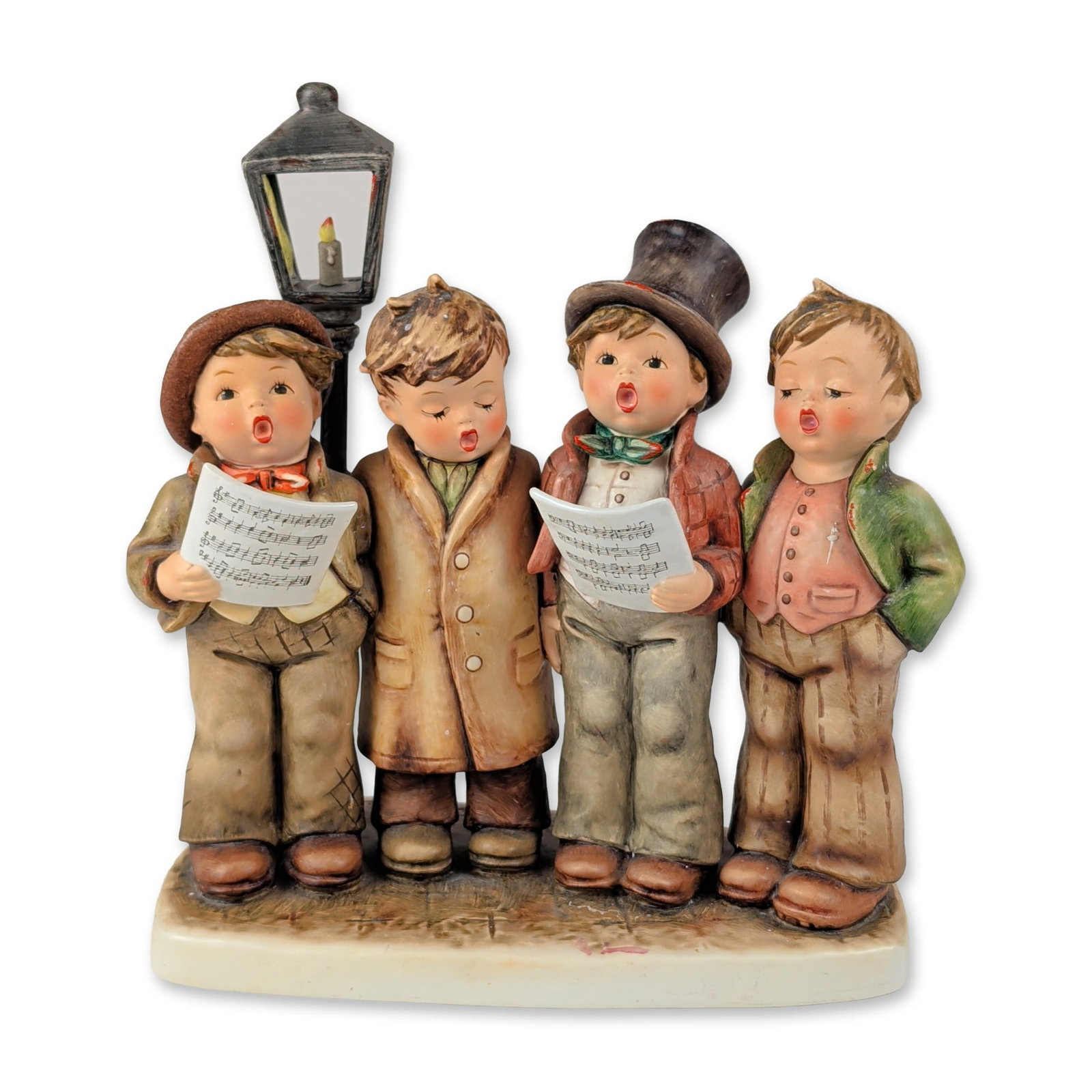 Goebel Hummel Harmony in Four Parts Ceramic Figurine: Goebel M.J. Hummel hand painted ceramic figurine titled Harmony in Four Parts, model number 286. This Century Collection piece depicts four boys in traditional cold weather attire singing as a quartet