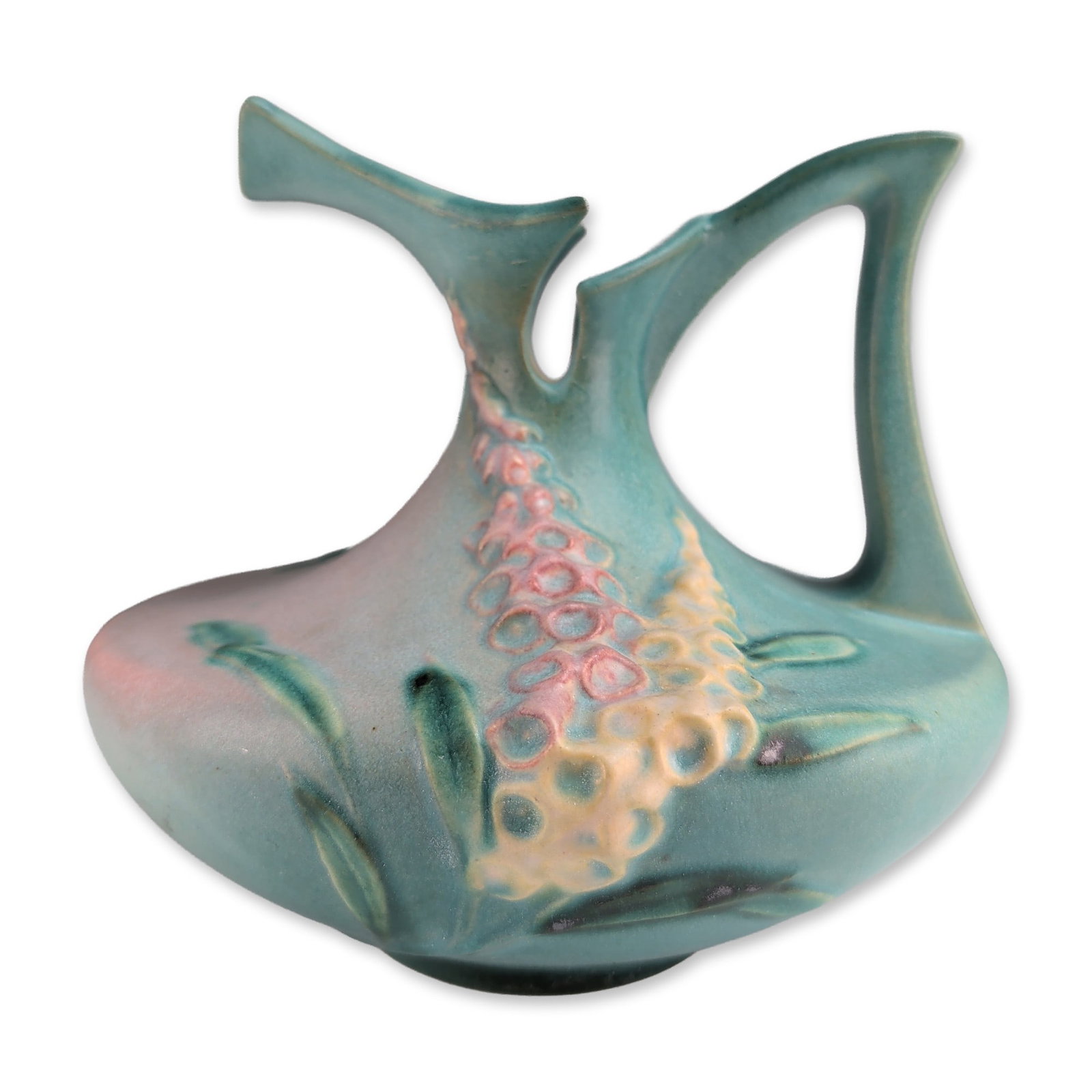 Roseville Foxglove Blue Earthenware Ewer: Roseville Pottery earthenware ewer in the Foxglove pattern, introduced in 1942. The vessel features a matte teal and blue-green shaded ground decorated with relief-molded foxglove blossoms in pink and