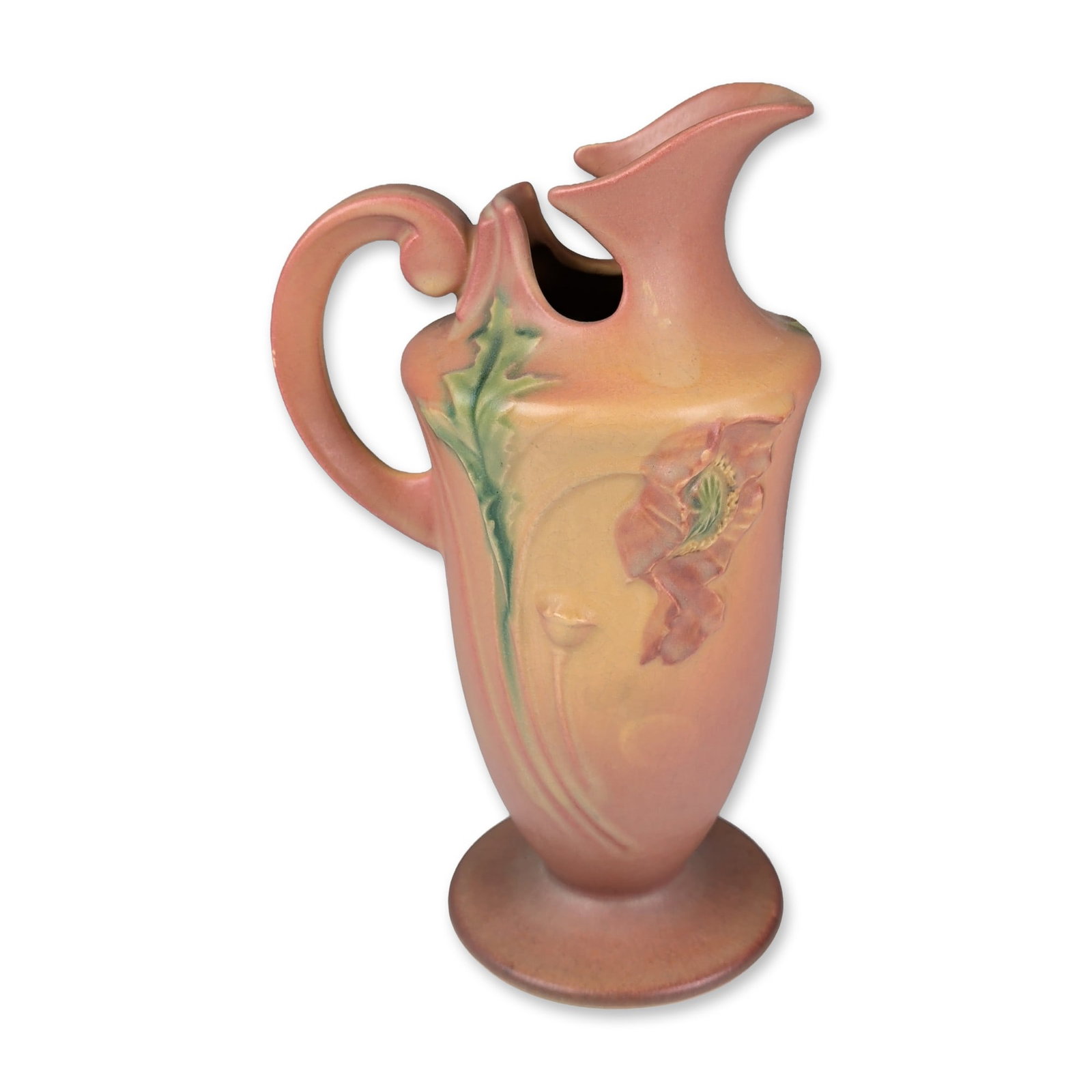Roseville Pottery Ewer, Blushed Pink Poppy: Roseville Pottery art pottery ewer in the Poppy pattern, introduced circa 1938. The vessel features a flared and bifurcated spout with a large scrolled handle on a bulbous body and pedestal base. The 