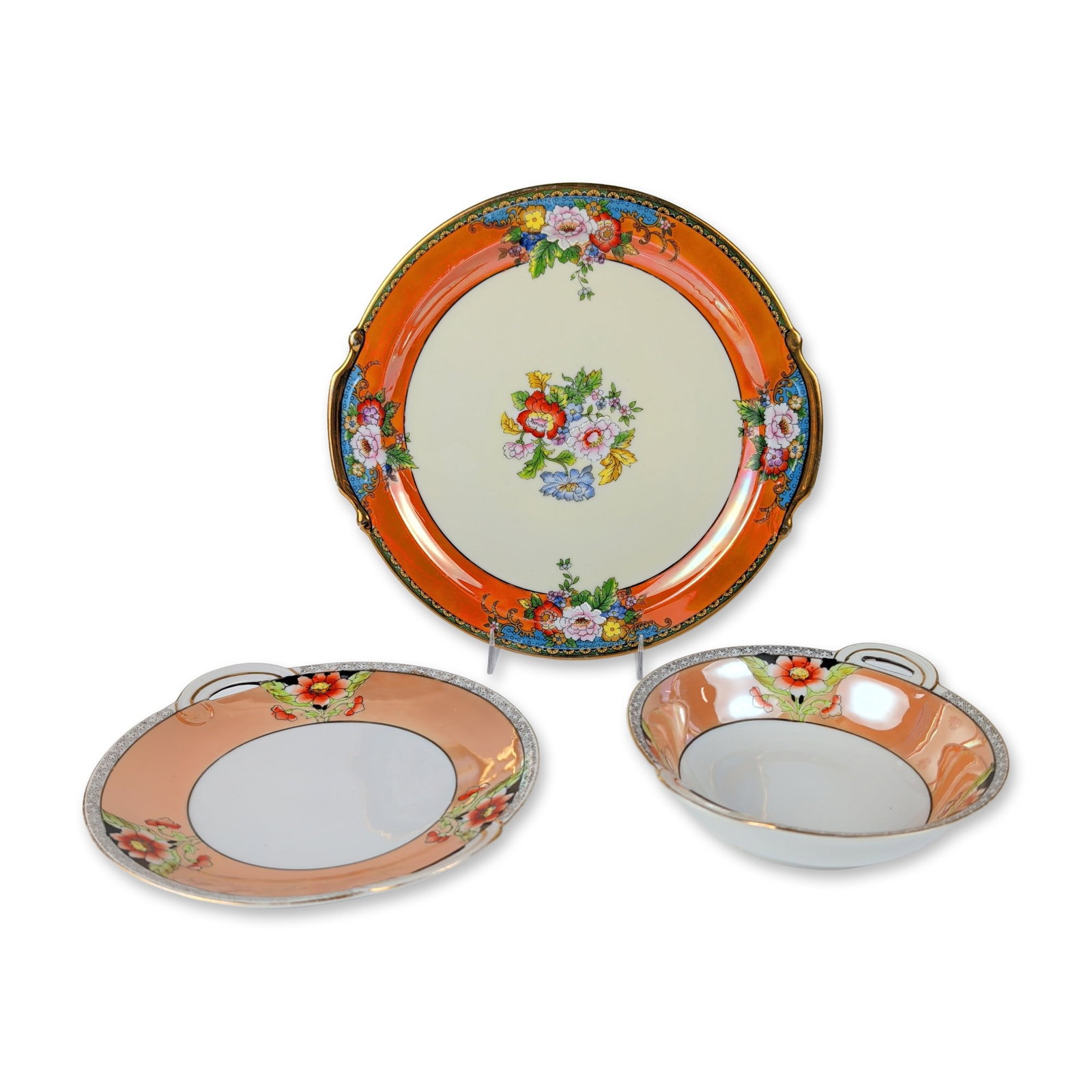 3pc Noritake Hand Painted Orange Lusterware Serving Plate and Bowl with Saucer: Noritake, Japan, trio in hand-painted porcelain with iridescent orange luster glaze, featuring polychrome floral bouquets. The set consists of a large round serving plate, a two-handled bouillon cup, 
