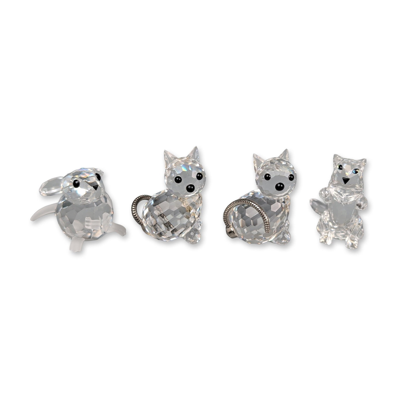 Collection of Four Swarovski Silver Crystal Animal Figurines: Swarovski Silver Crystal group of four faceted lead crystal animal figurines, featuring one mouse and three cats. The mouse is designed with a faceted body, frosted plastic or glass ears and feet, and