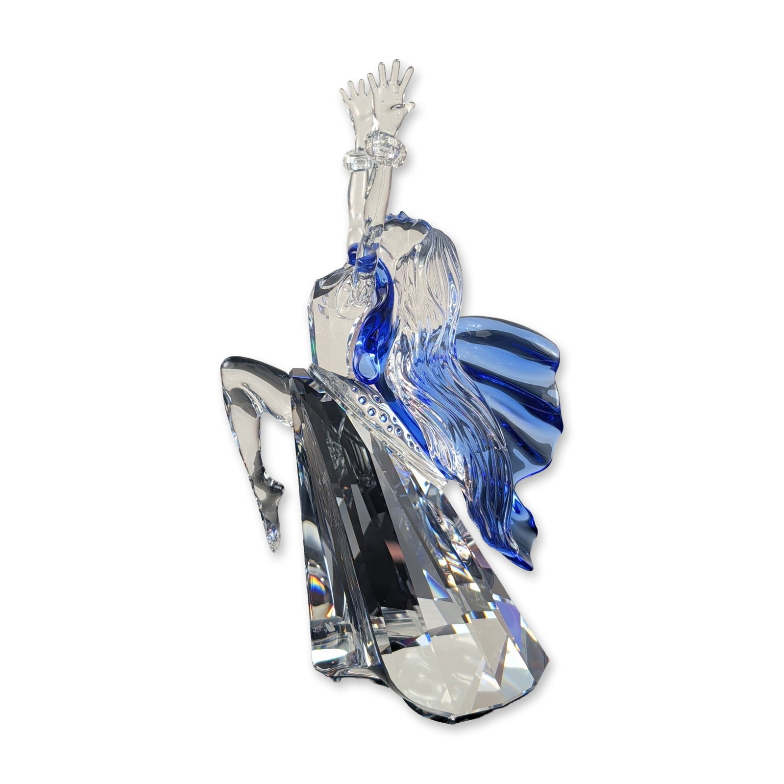 Swarovski Crystal Isadora Magic of Dance Figurine: Swarovski Crystal Society 2002 annual edition figurine titled Isadora, the first release in the Magic of Dance trilogy. The piece is constructed from faceted clear and cobalt blue lead crystal, depict