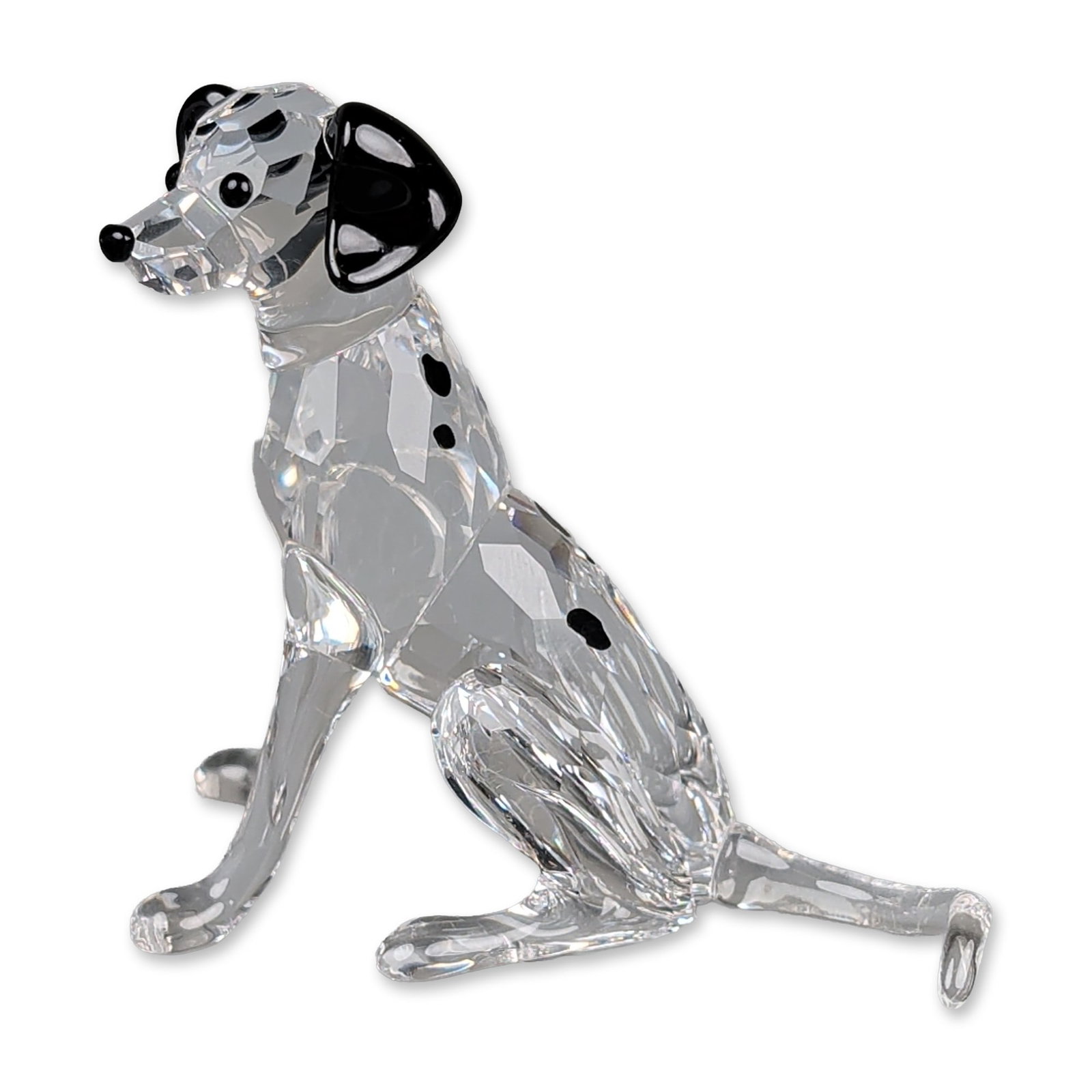 Swarovski Crystal Figurine, Dalmatian Mother: Swarovski crystal figurine of a Dalmatian Mother in a sitting pose. Constructed of faceted clear crystal with applied black crystal ears and nose, featuring inset black spots. Accompanied by the origi