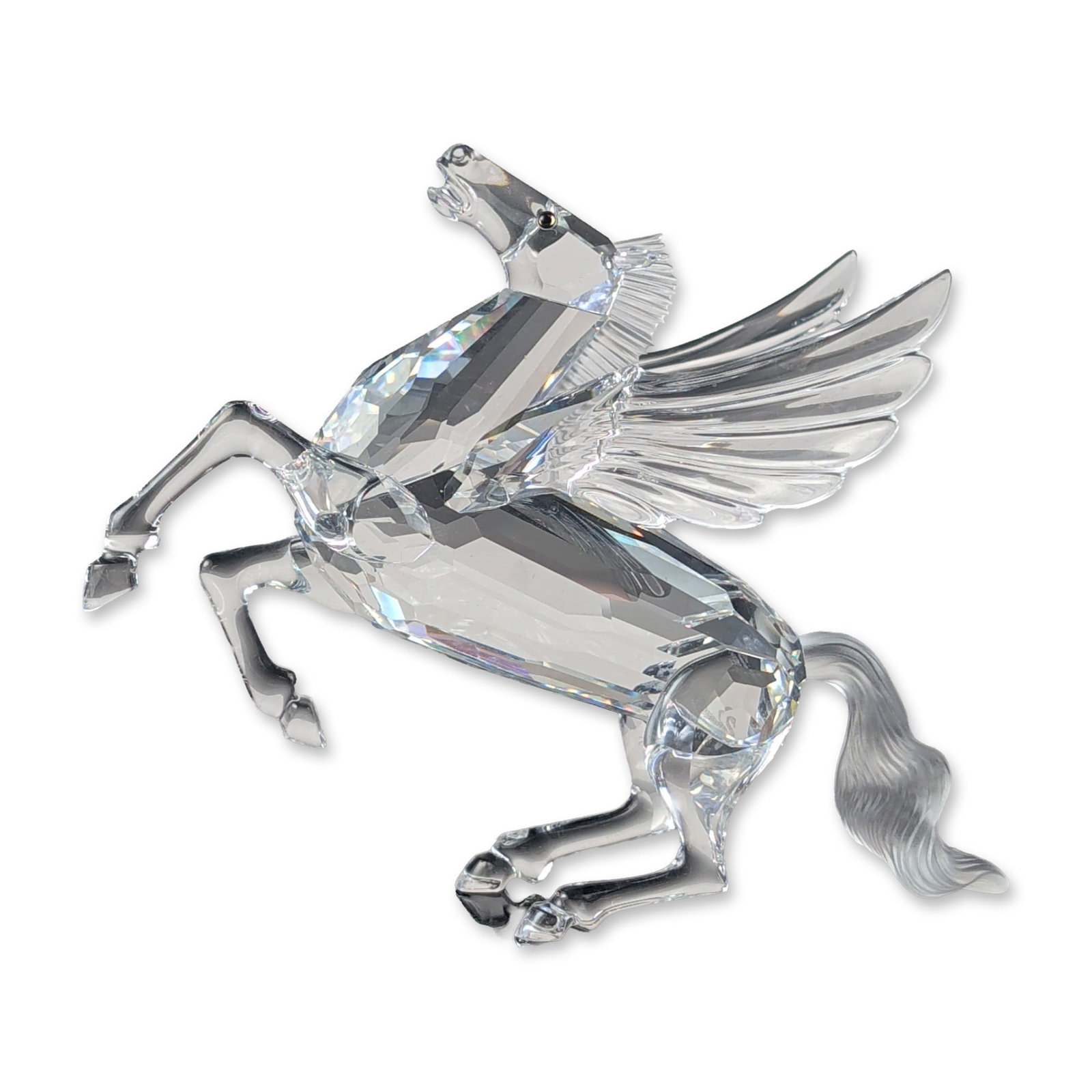 Swarovski 1998 Annual Edition Pegasus Figurine: Swarovski. Pegasus figurine in clear faceted crystal with frosted crystal accents, from the 1998 Annual Edition Fabulous Creatures series. The figurine features a faceted body and legs, frosted